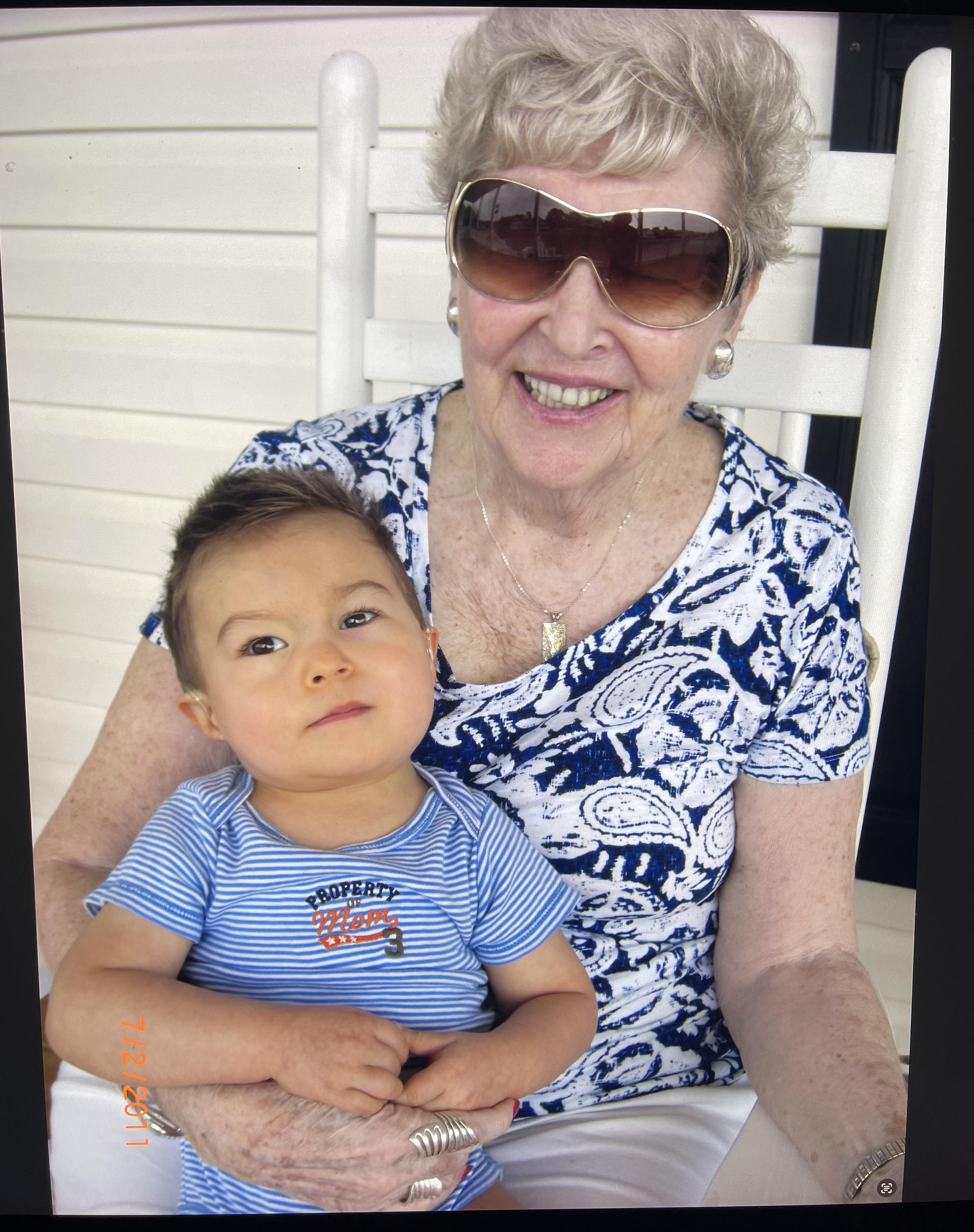 An older woman holding a young boy