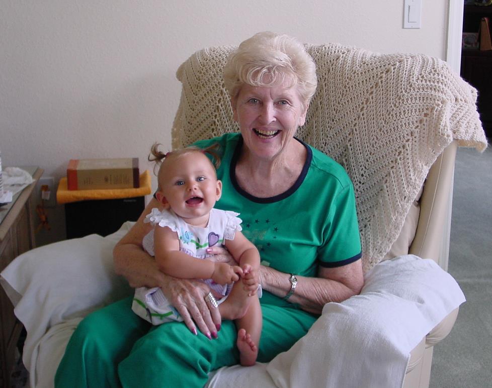 An old woman holding a baby