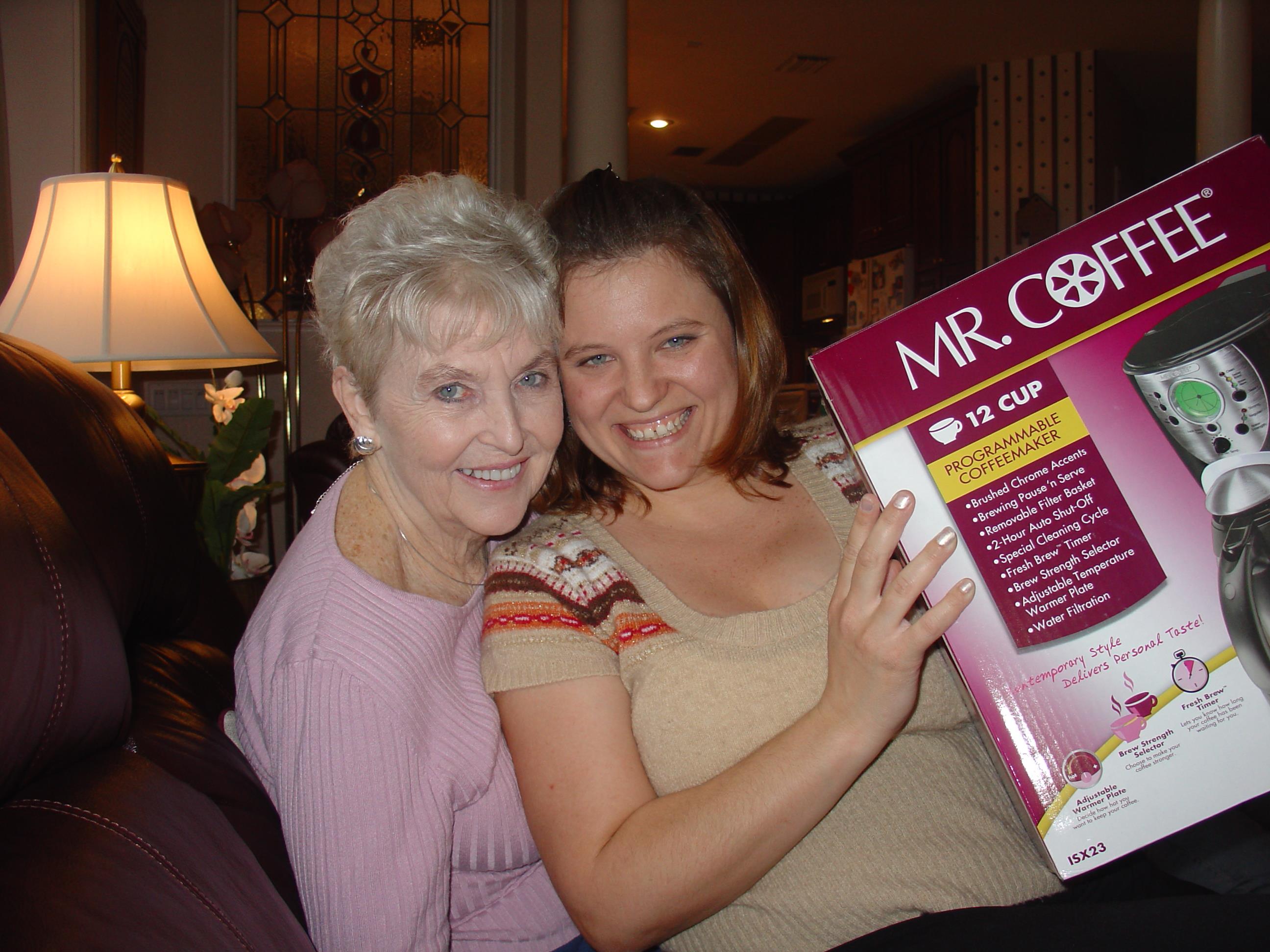 A woman and a woman holding a book