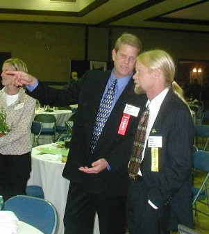 A man pointing at another man