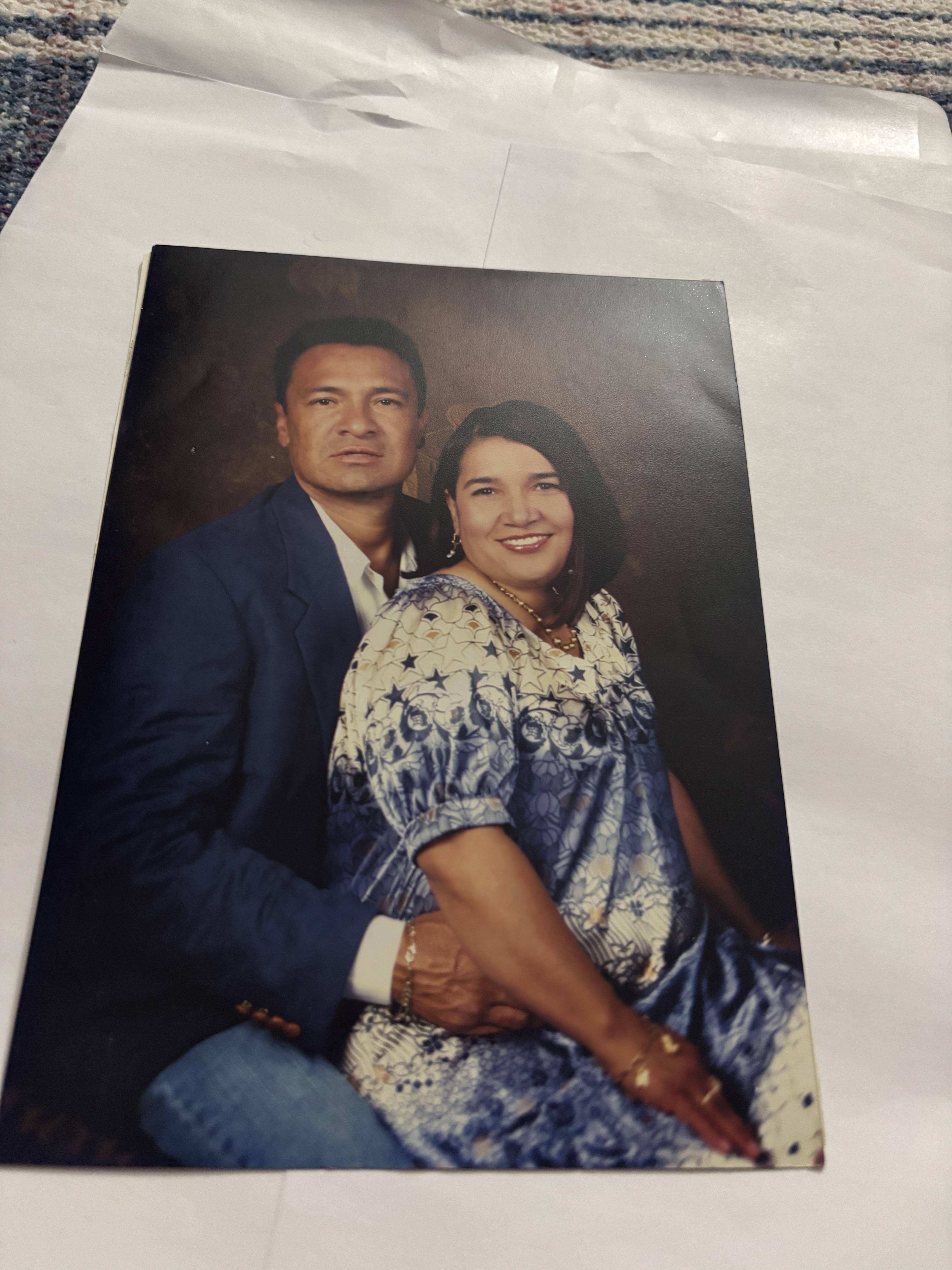 A man and woman posing for a picture