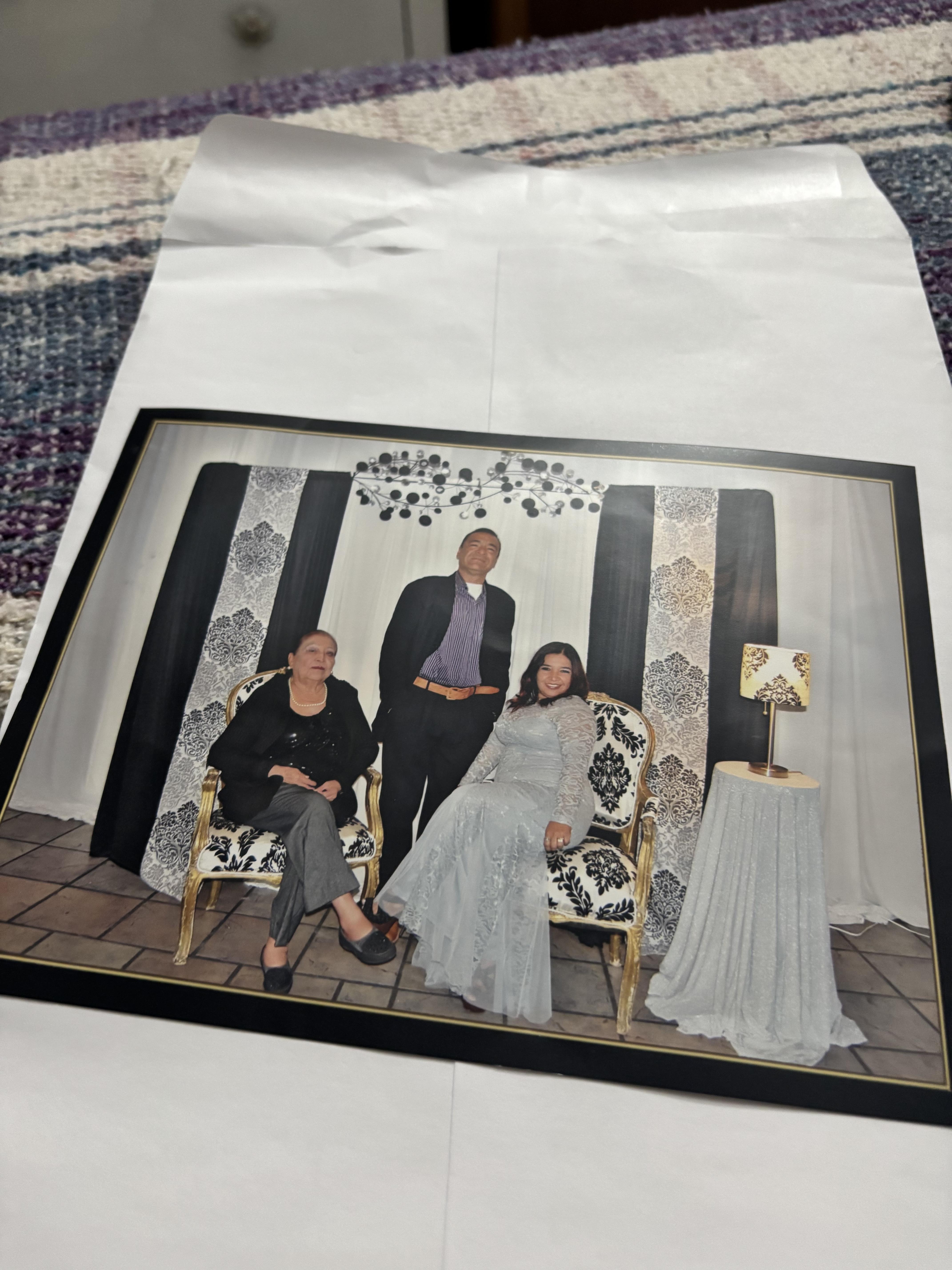 A photo of a family sitting on a chair