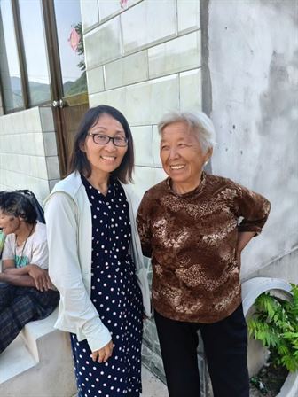 Two women standing next to each other