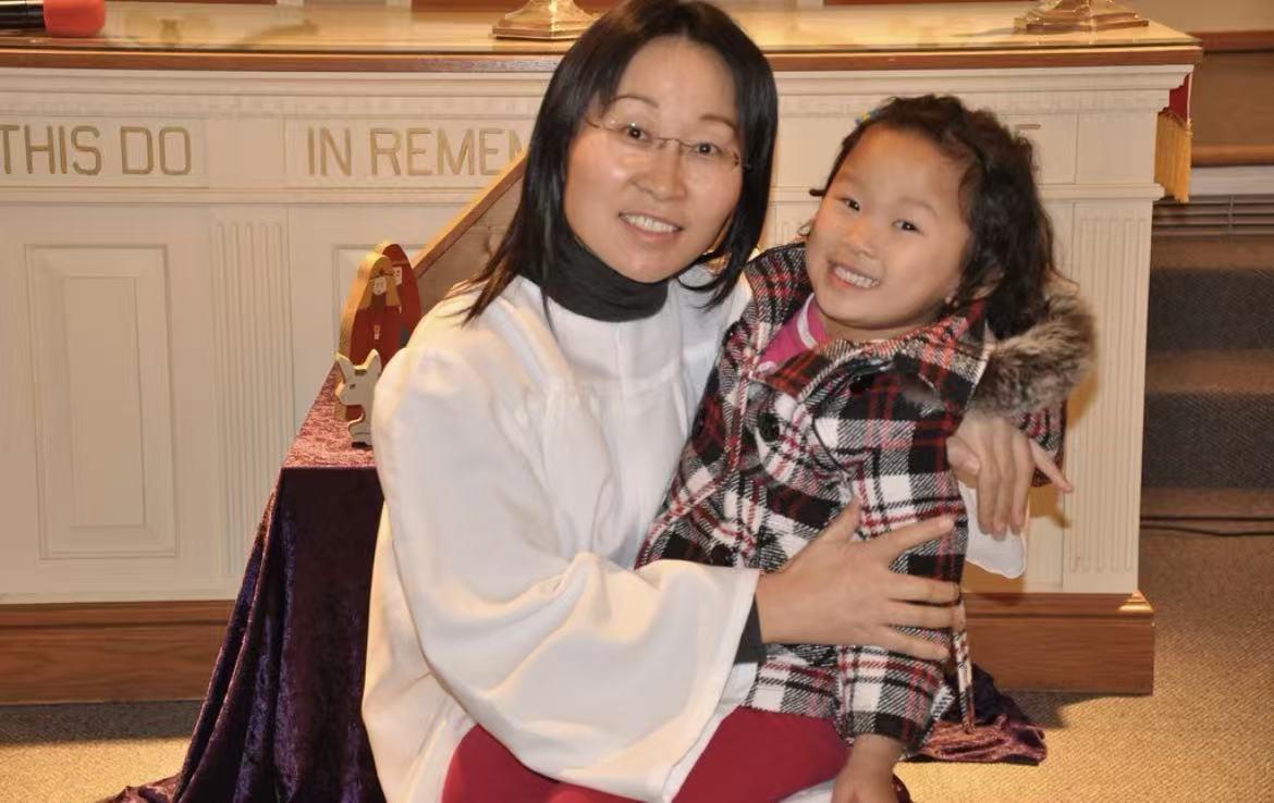 A woman holding a child