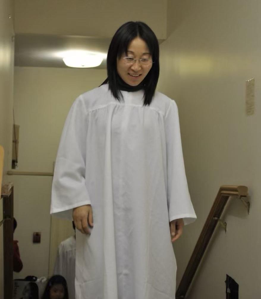 A woman wearing a white robe