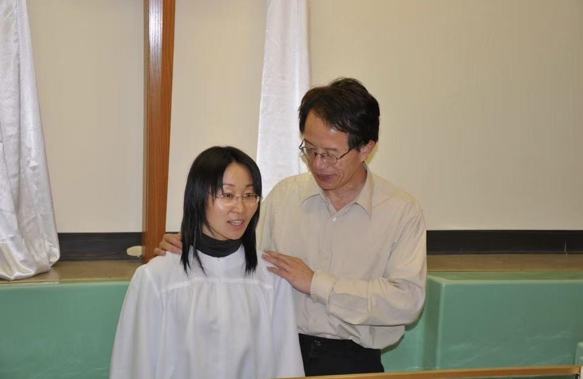 A man and woman standing next to each other