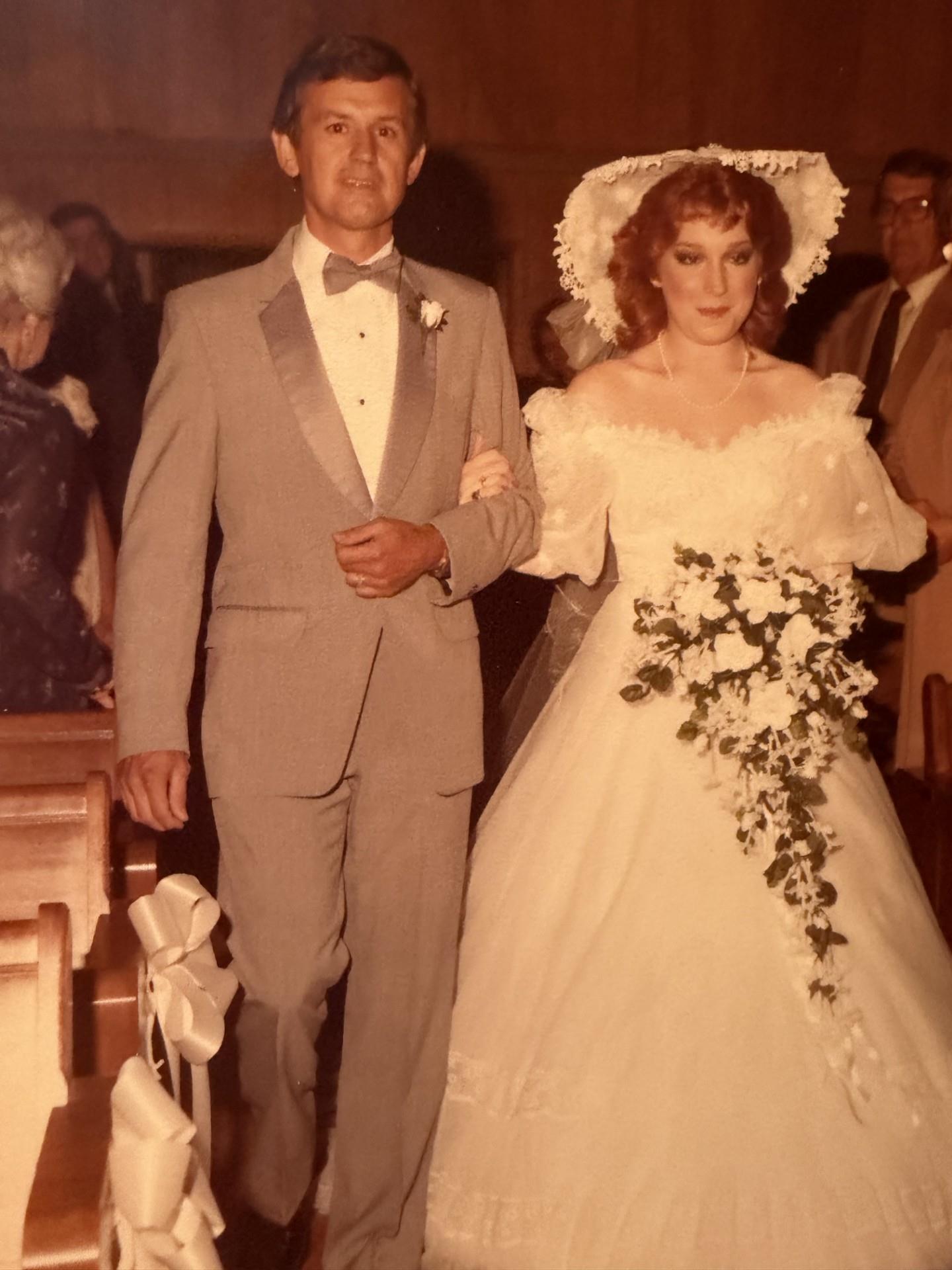 A man and woman in wedding attire