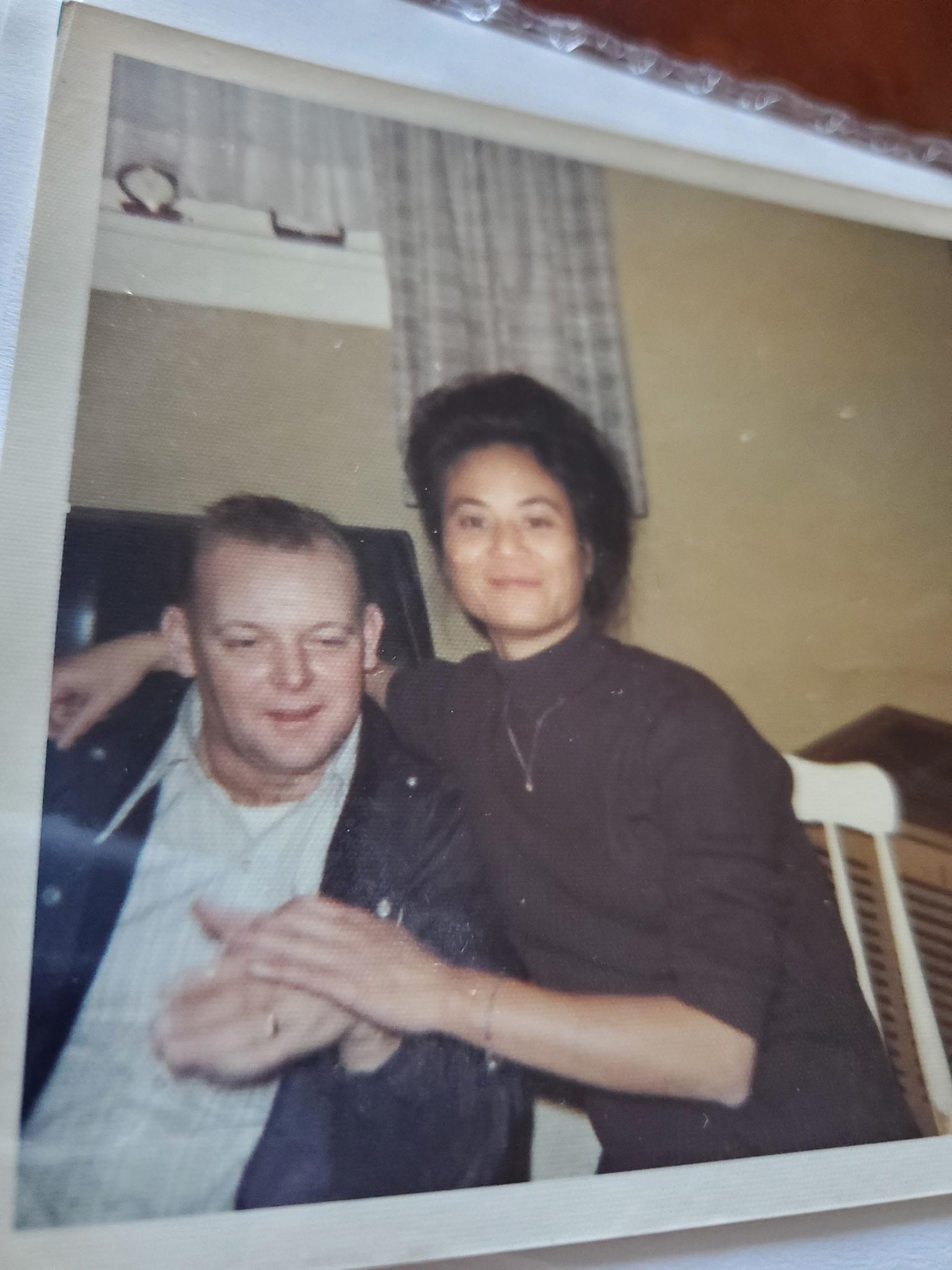 A man and woman posing for a picture