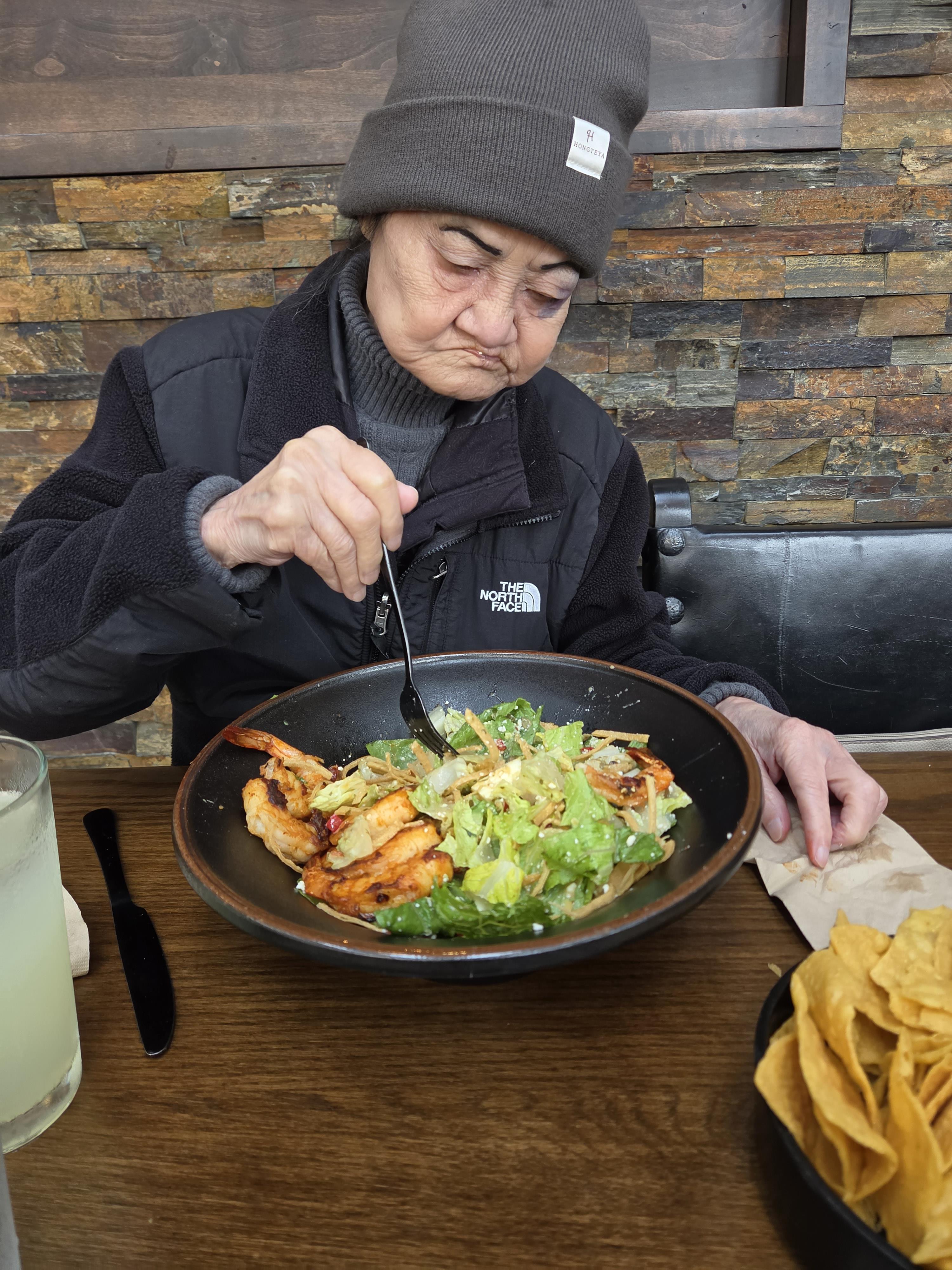 A woman eating a salad