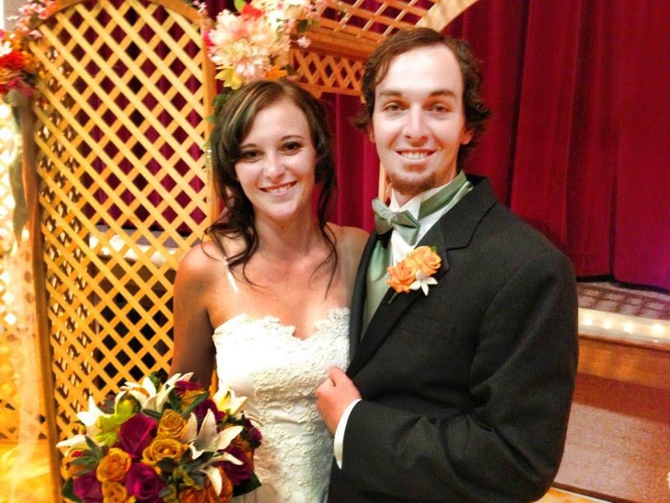 A man and woman posing for a picture