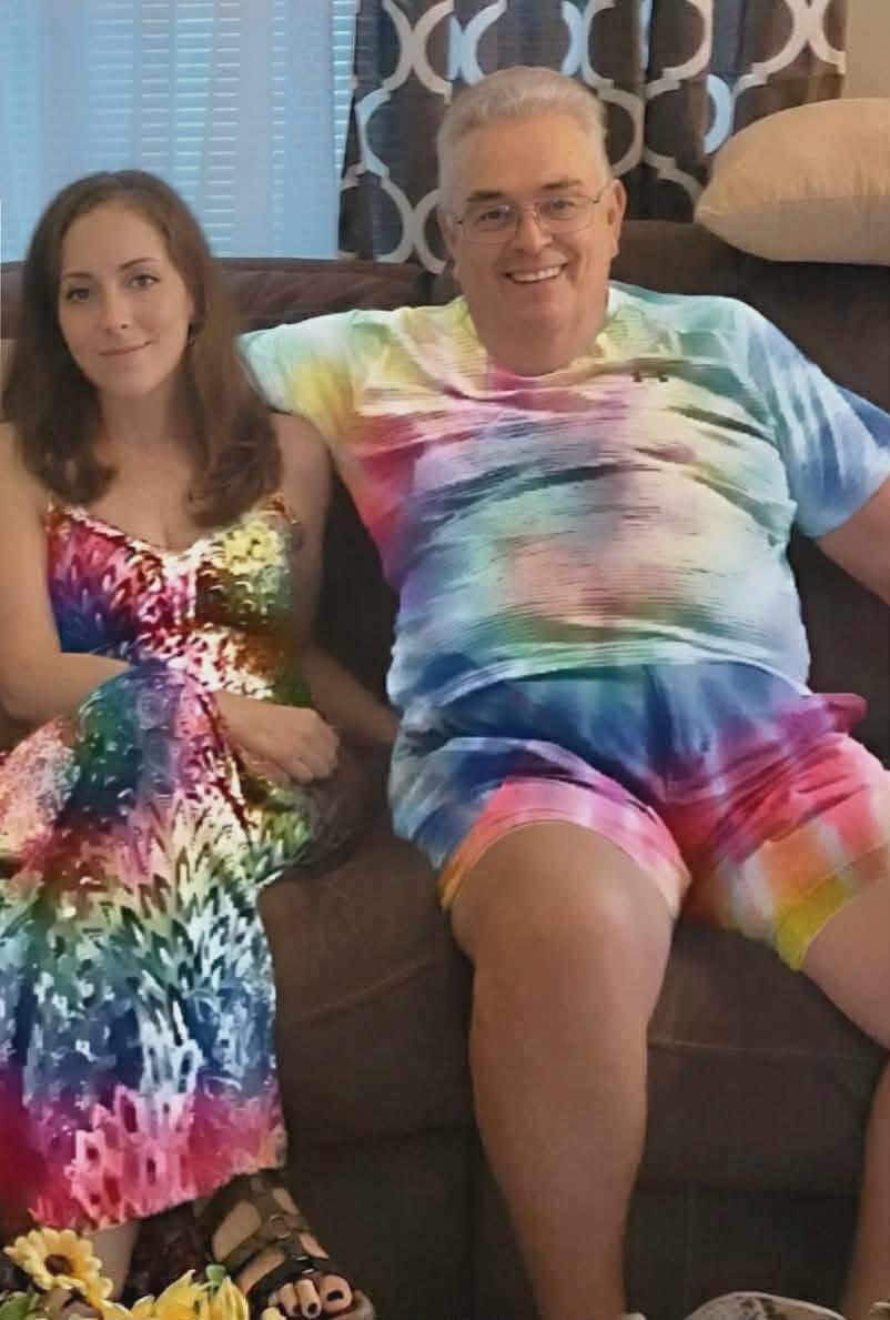 A man and woman sitting on a couch