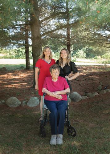 A group of women standing in a wheelchair