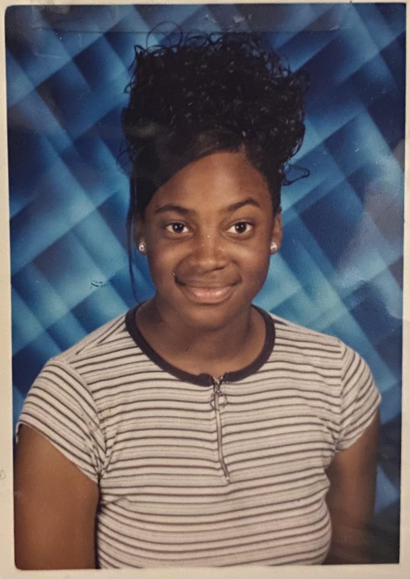 A young woman with a high bun