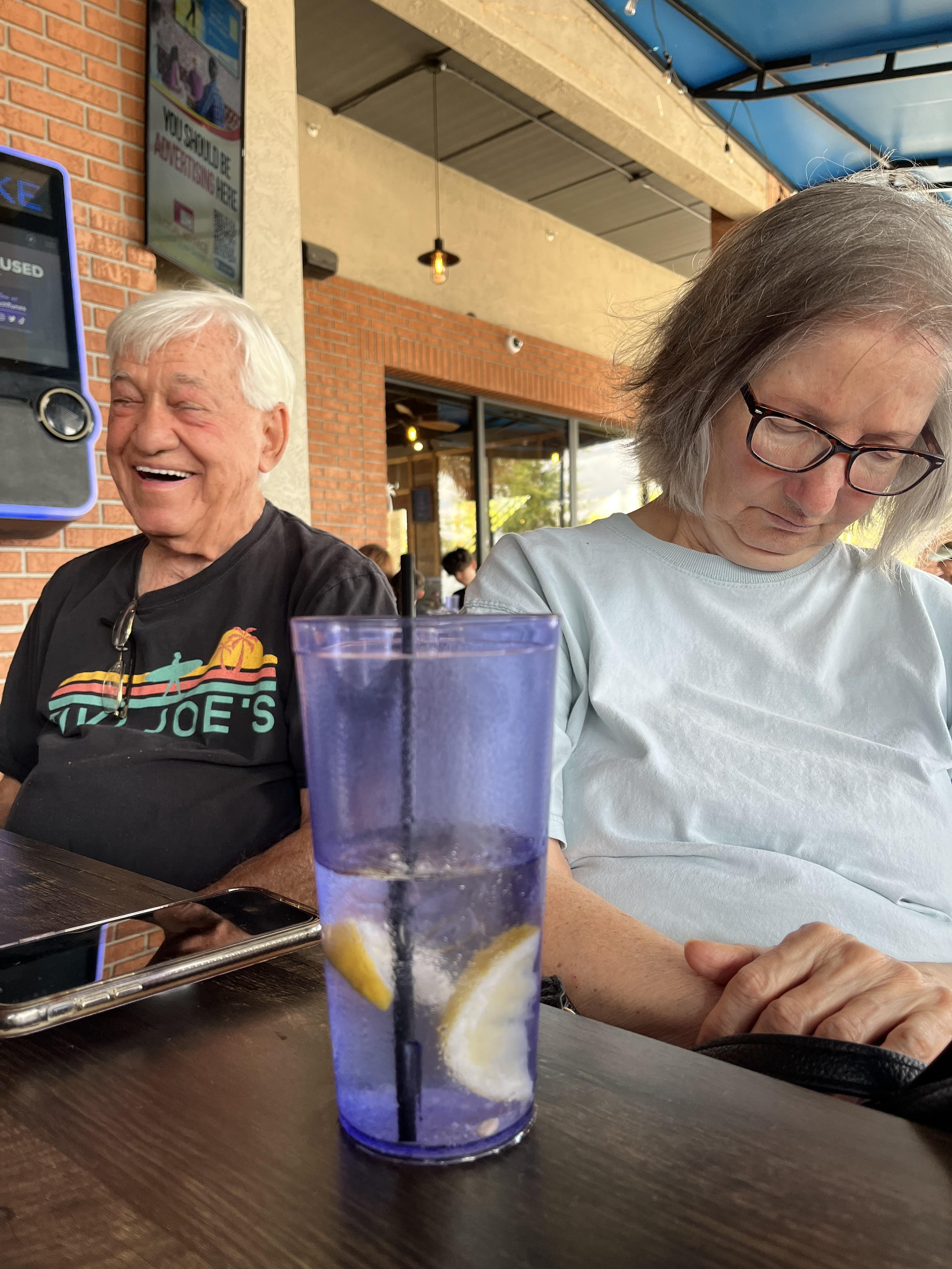 A woman and man sitting at a table
