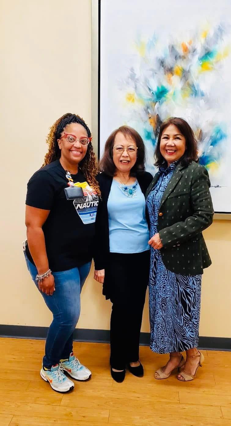 A group of women standing together smiling