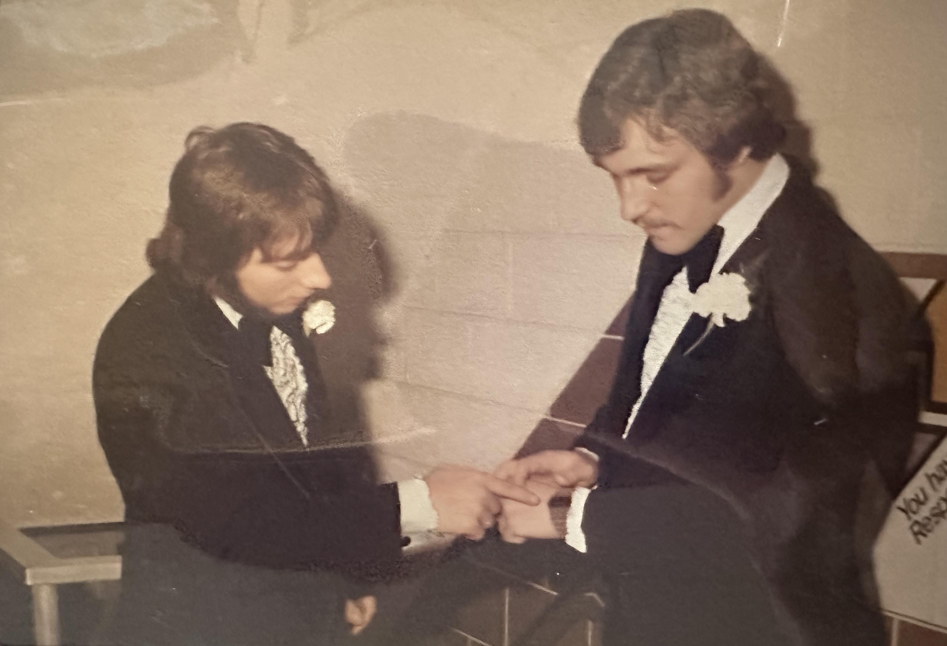 A couple of men in suits