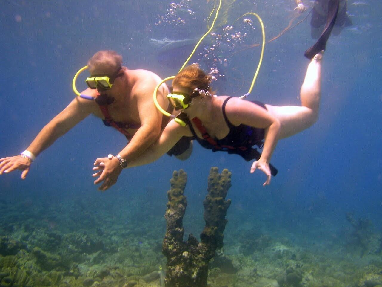 A man and woman underwater