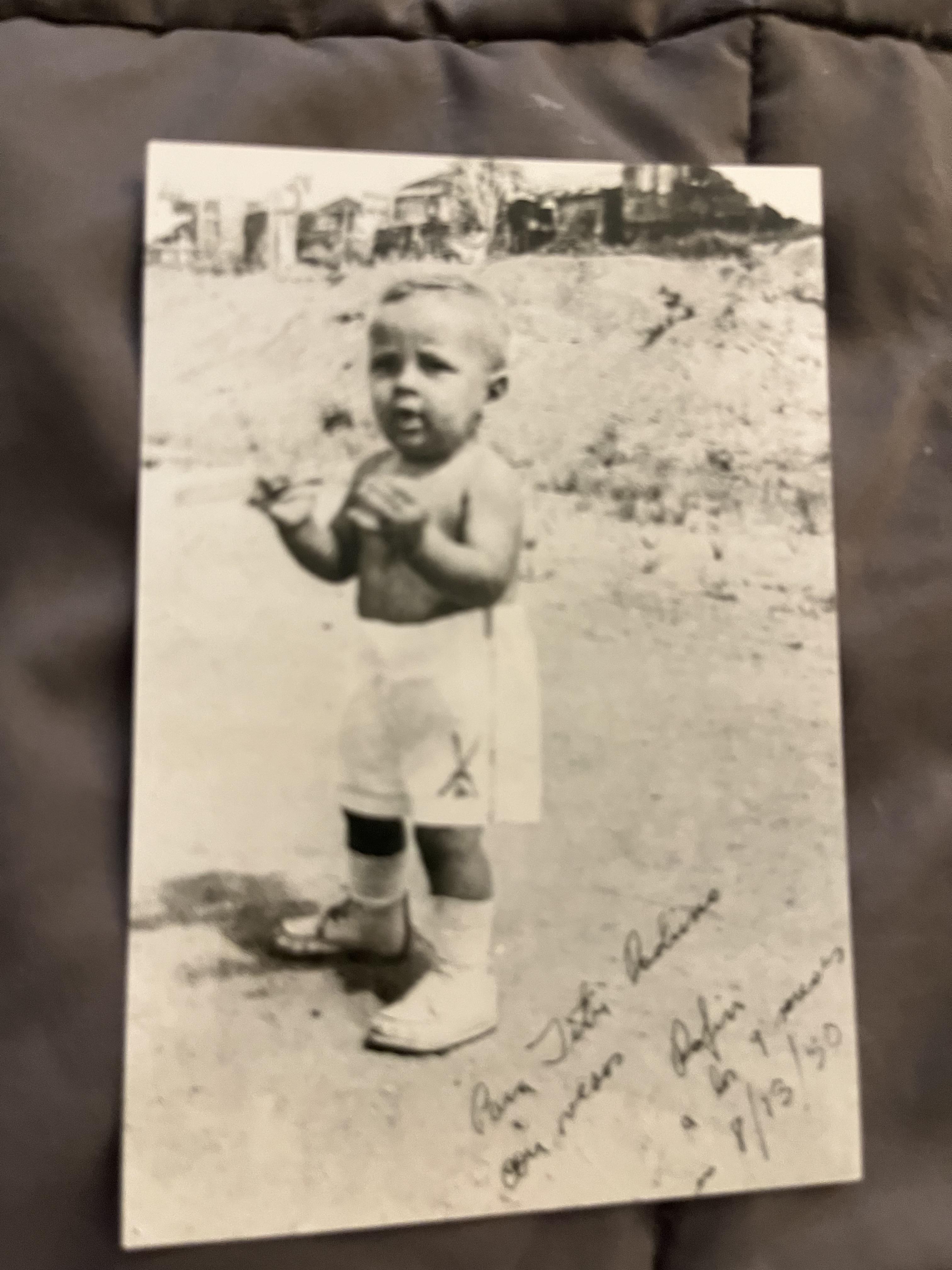 A black and white photo of a baby