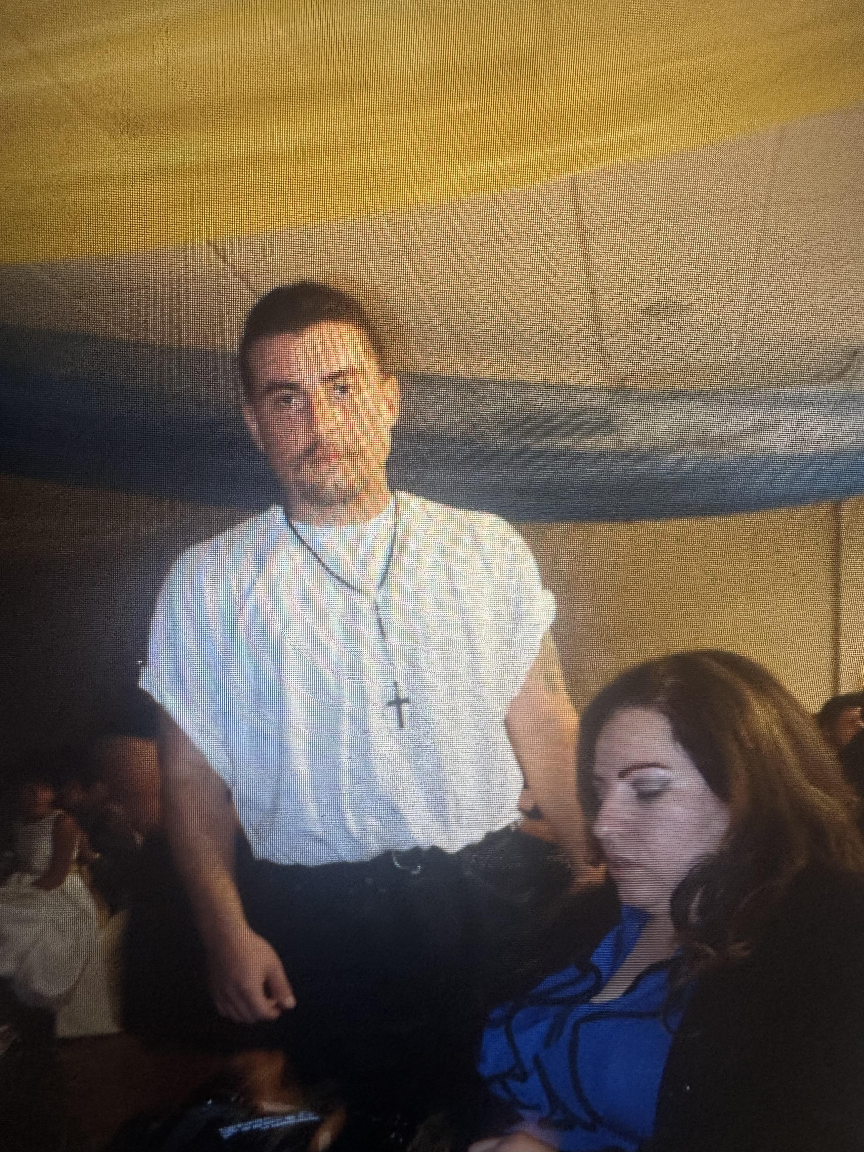 A man standing next to a woman