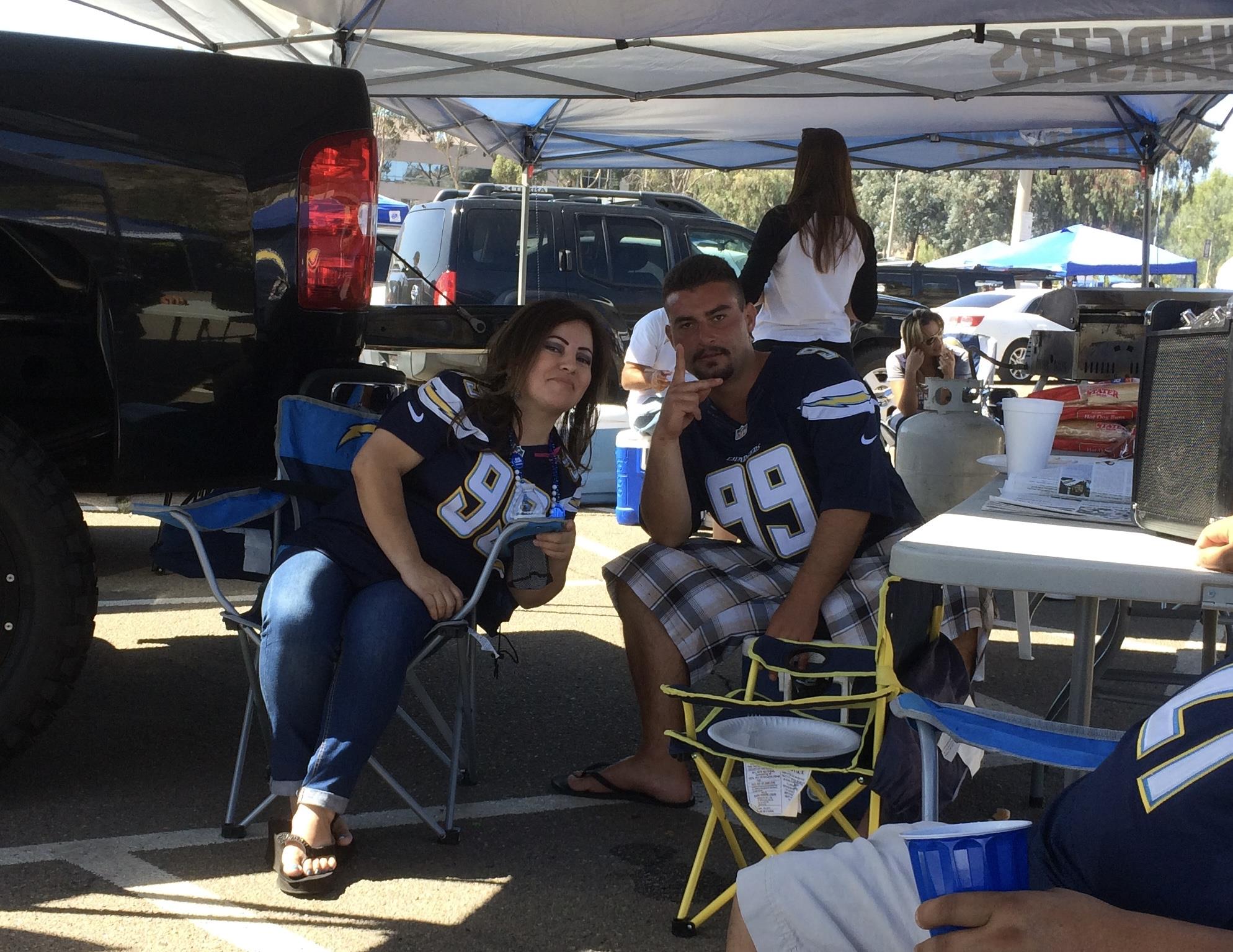 A couple of people sitting under a tent