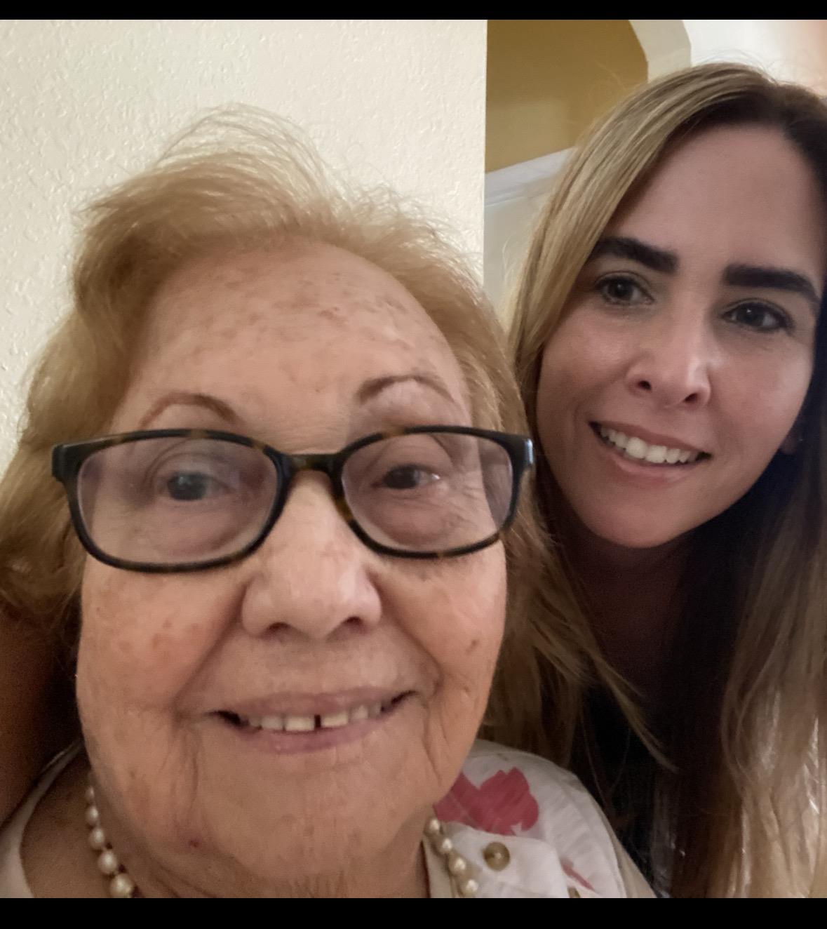 A woman and a young woman taking a selfie