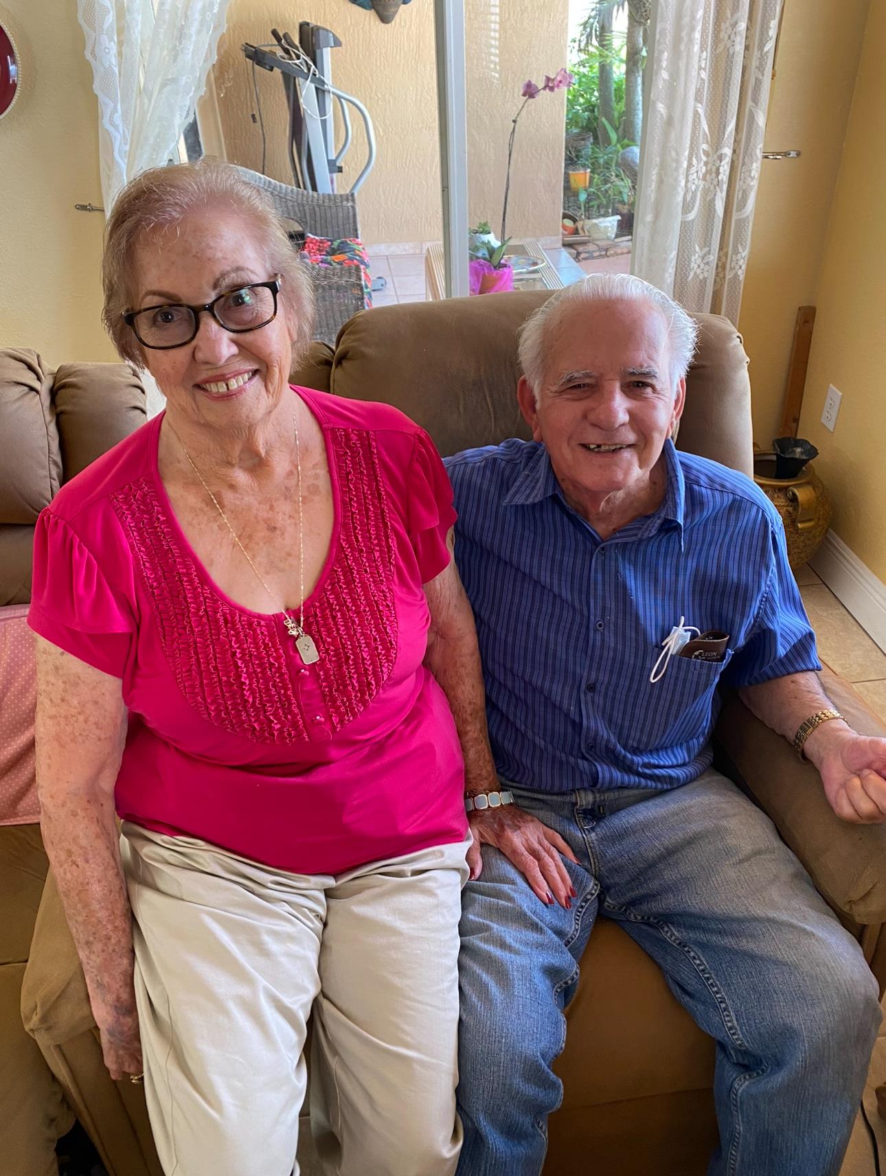 A man and woman sitting on a couch