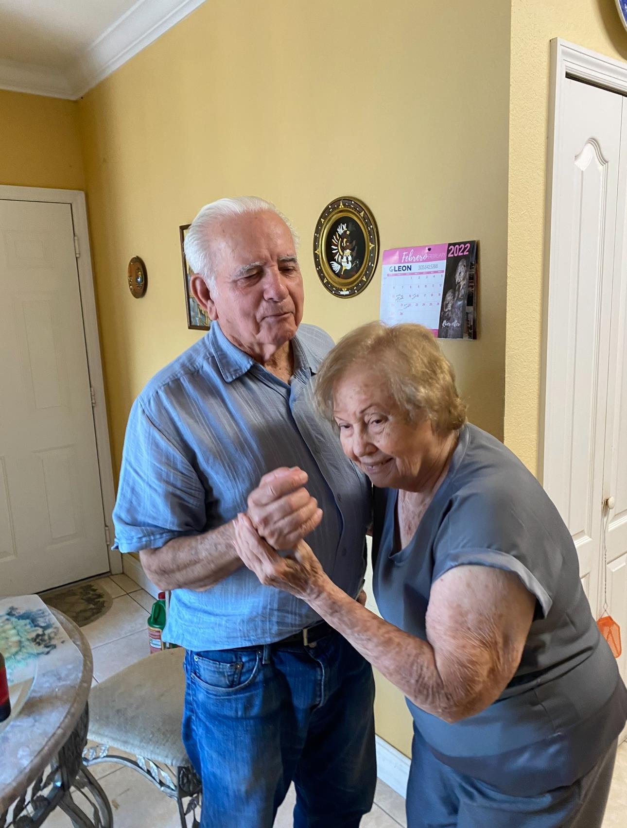 A man and woman dancing in a room