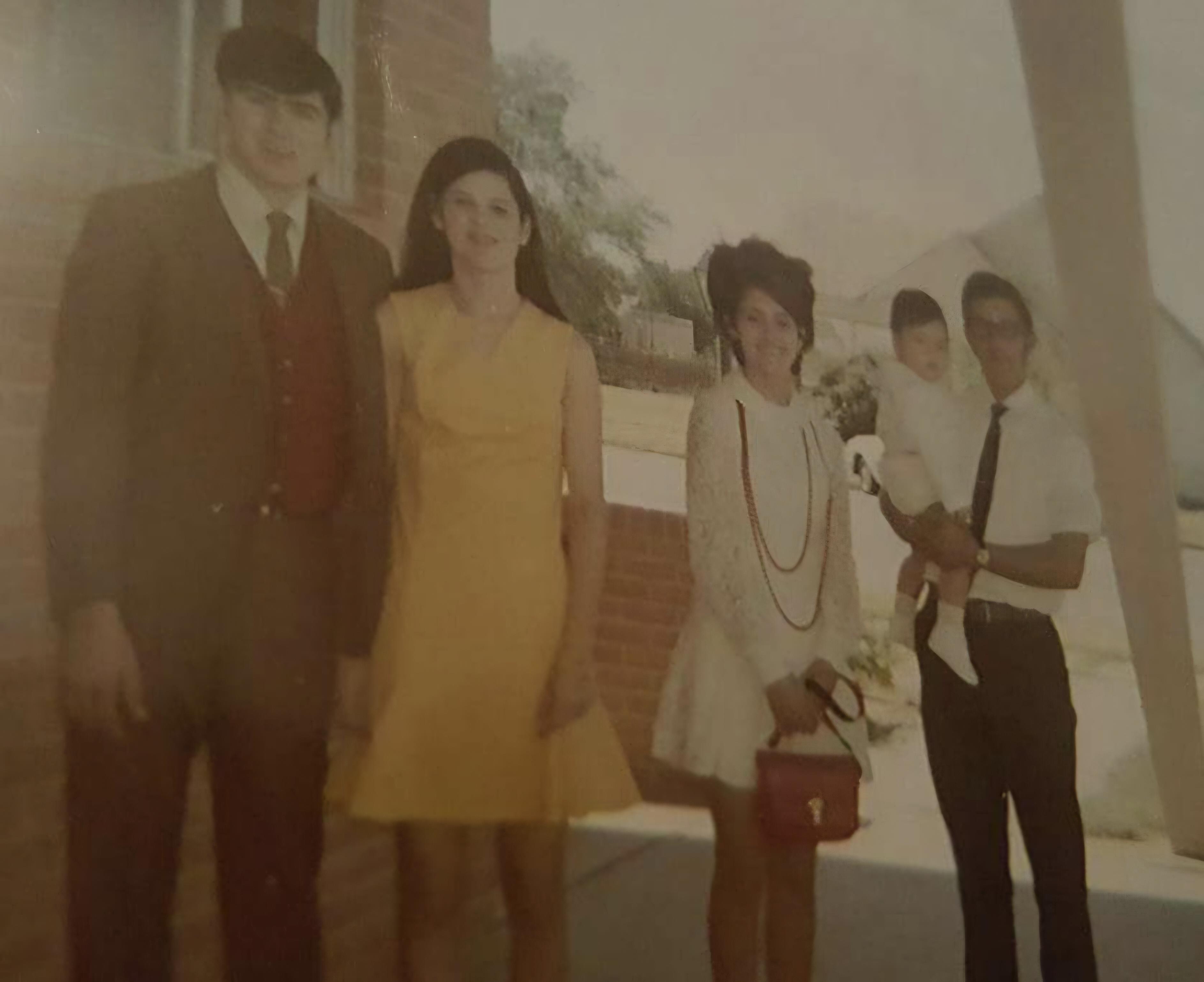 A group of people standing outside a building