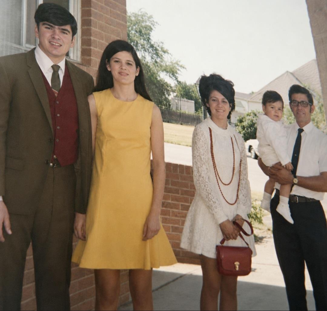 A group of people standing outside a building