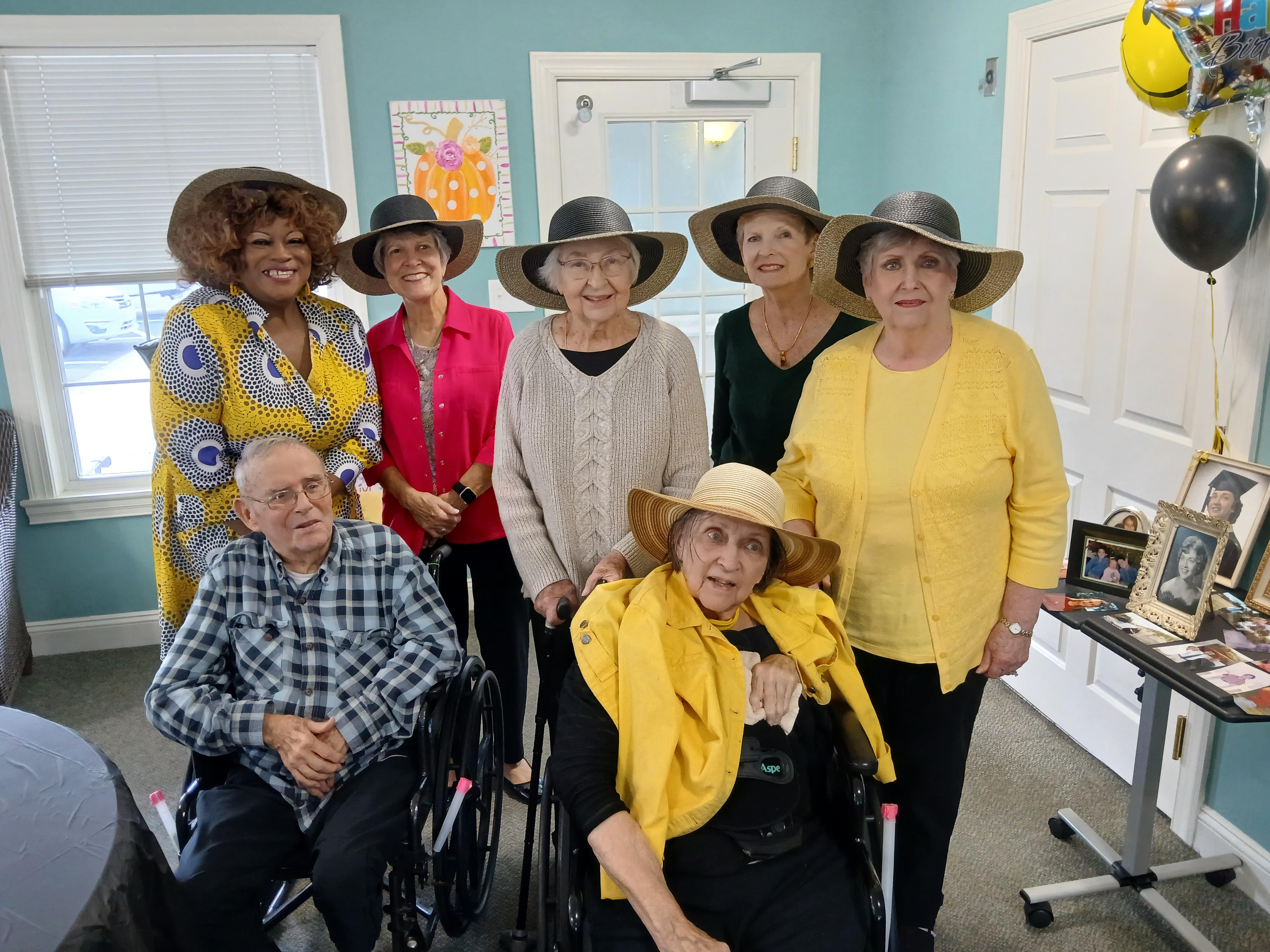 A group of people wearing hats