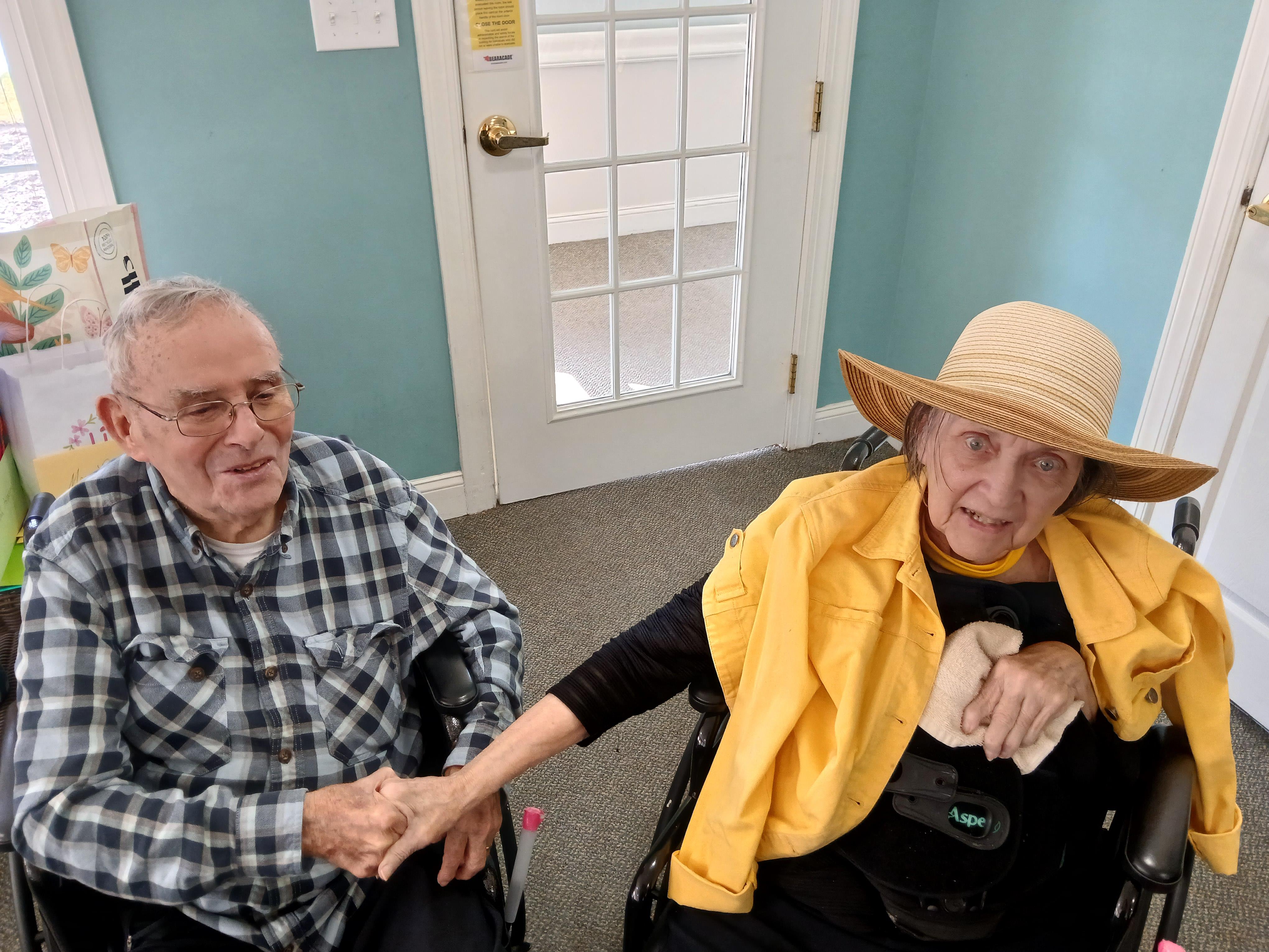 A man and woman in wheelchairs