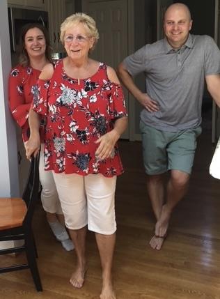 A group of people standing in a room