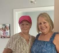 Two women smiling at the camera