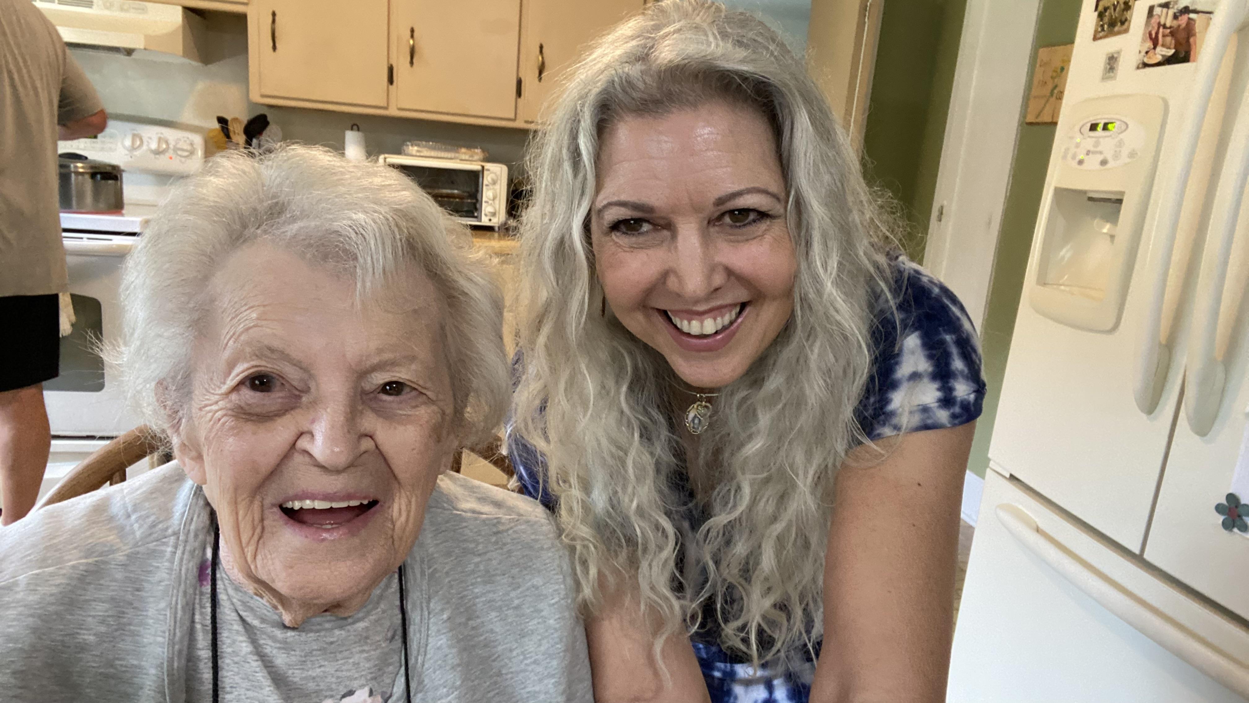 Two women smiling at the camera