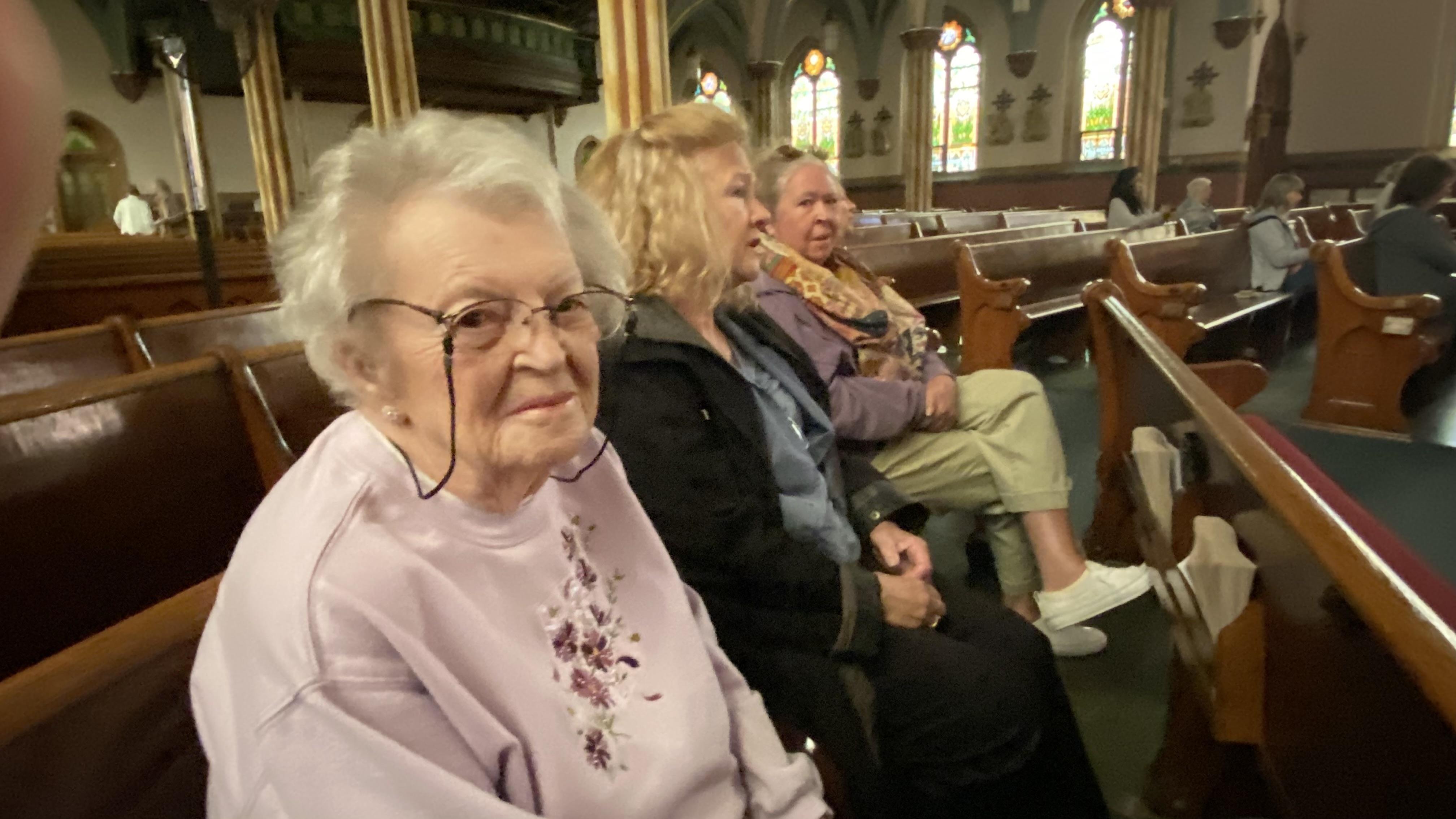 A group of people sitting in pews
