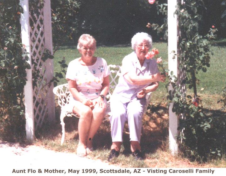 A couple of older women sitting on a bench