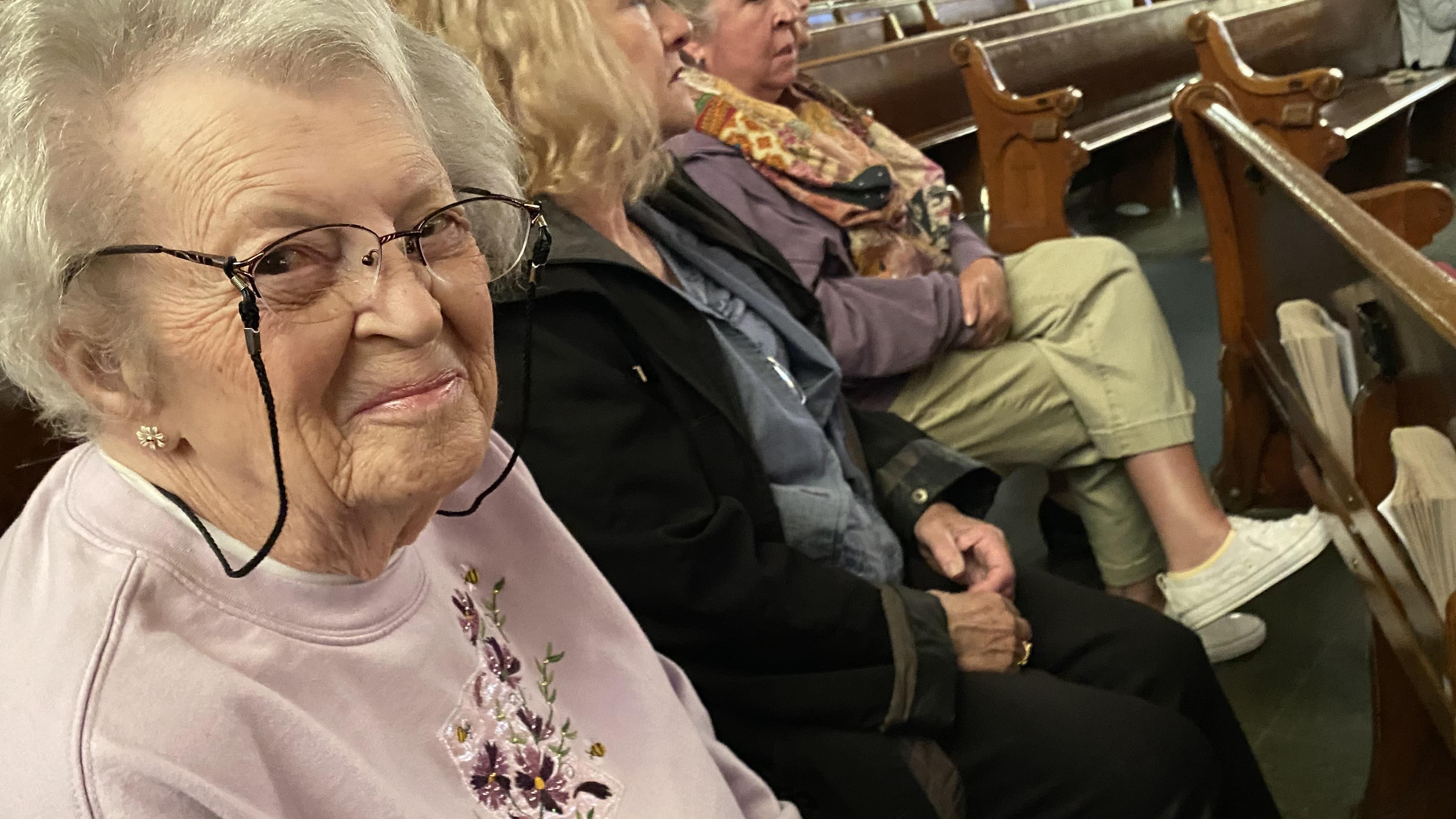 A group of people sitting in a row