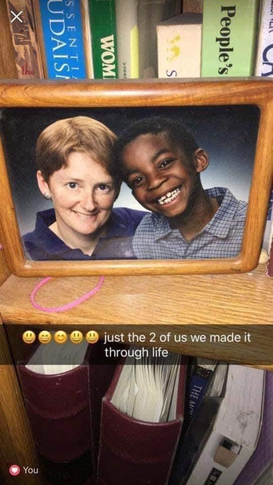 A framed picture of a woman and a boy