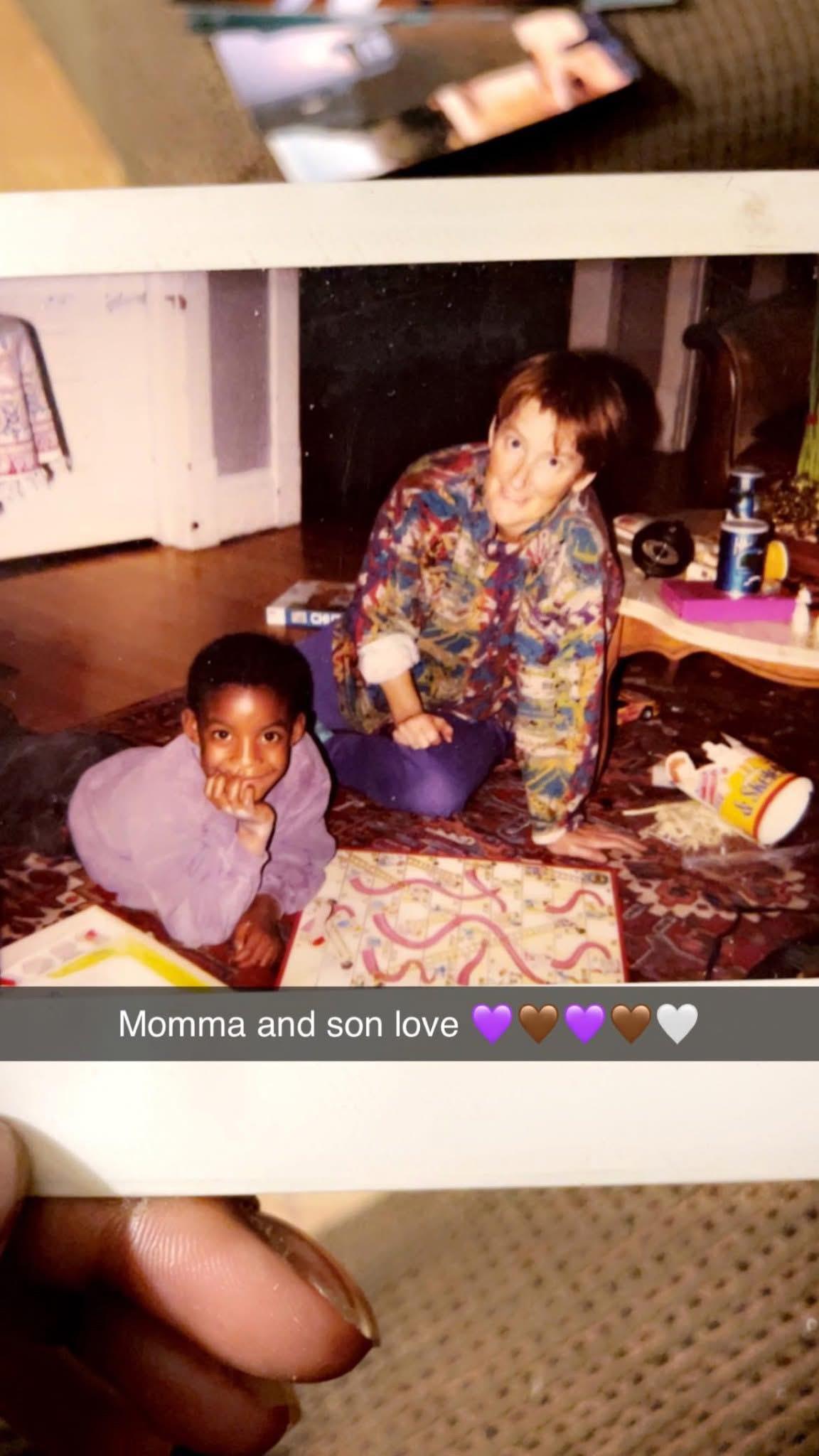 A woman and a child sitting on the floor