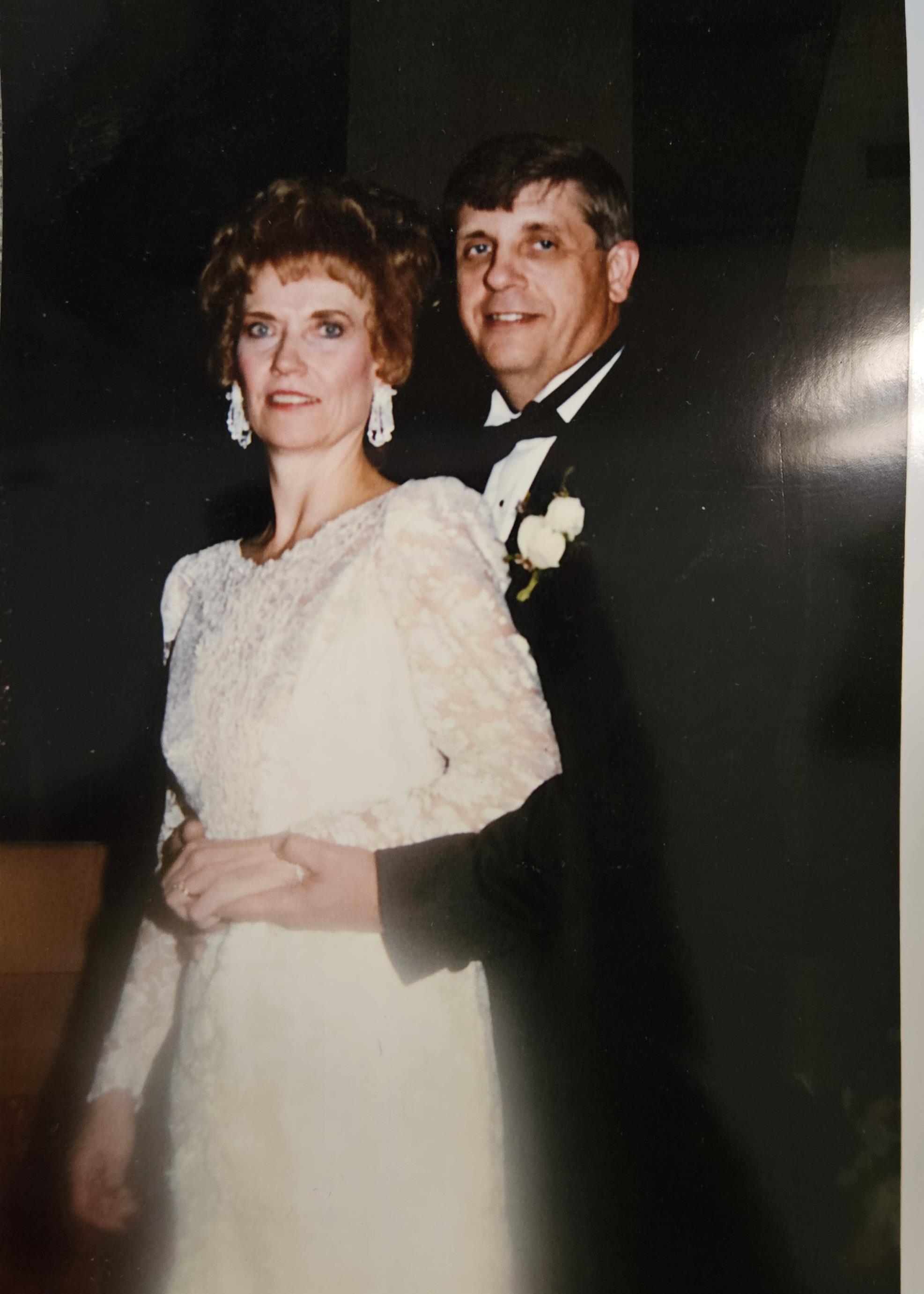 A man and woman posing for a picture