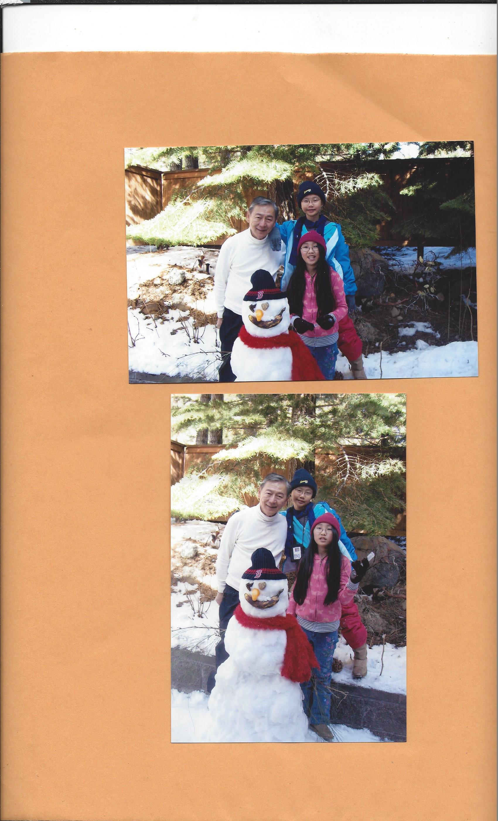 A group of people posing with a snowman