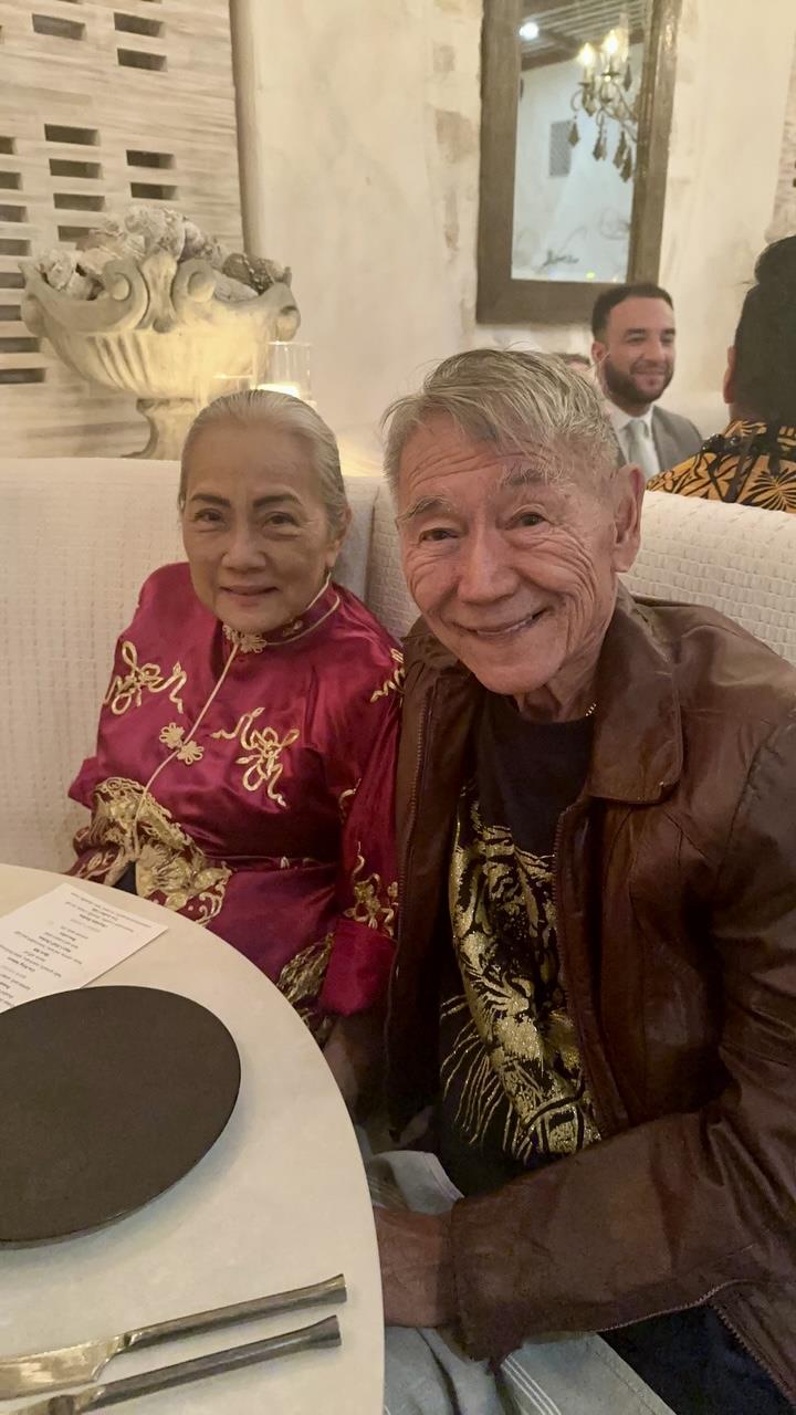 A man and woman sitting at a table