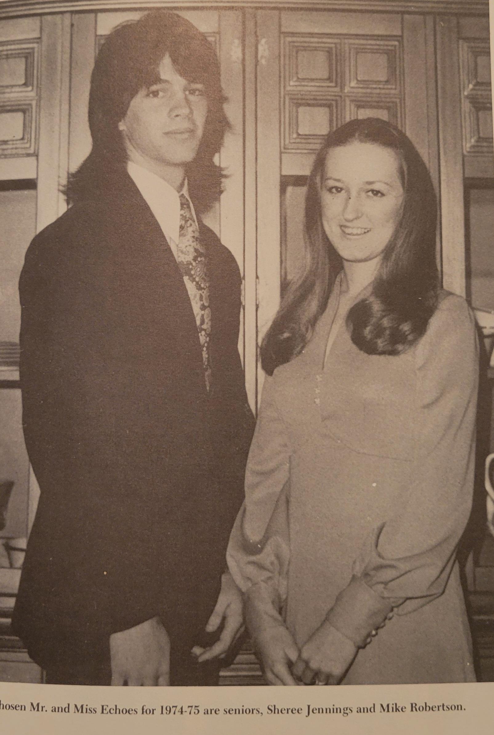 A man and woman standing next to each other