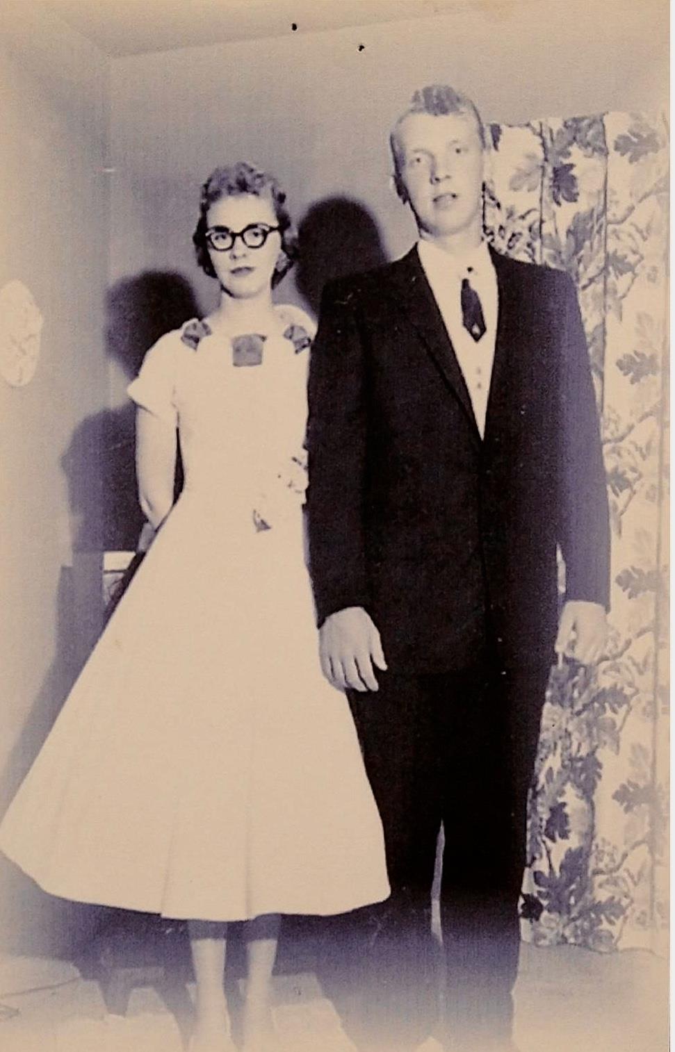 A man and woman posing for a picture