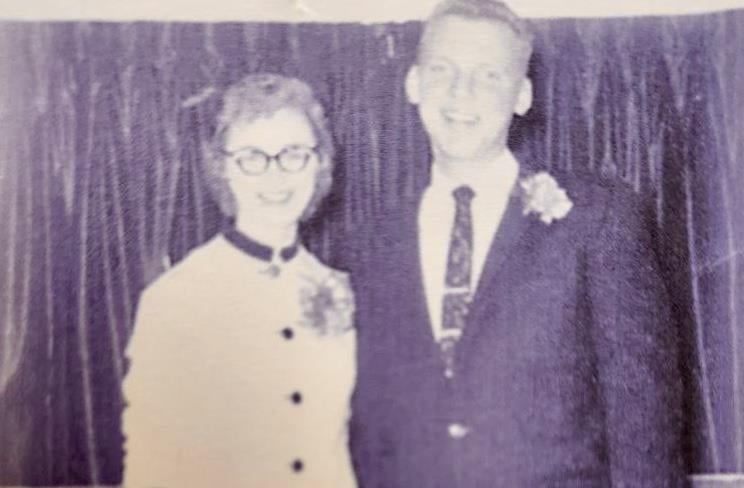 A man and woman posing for a picture