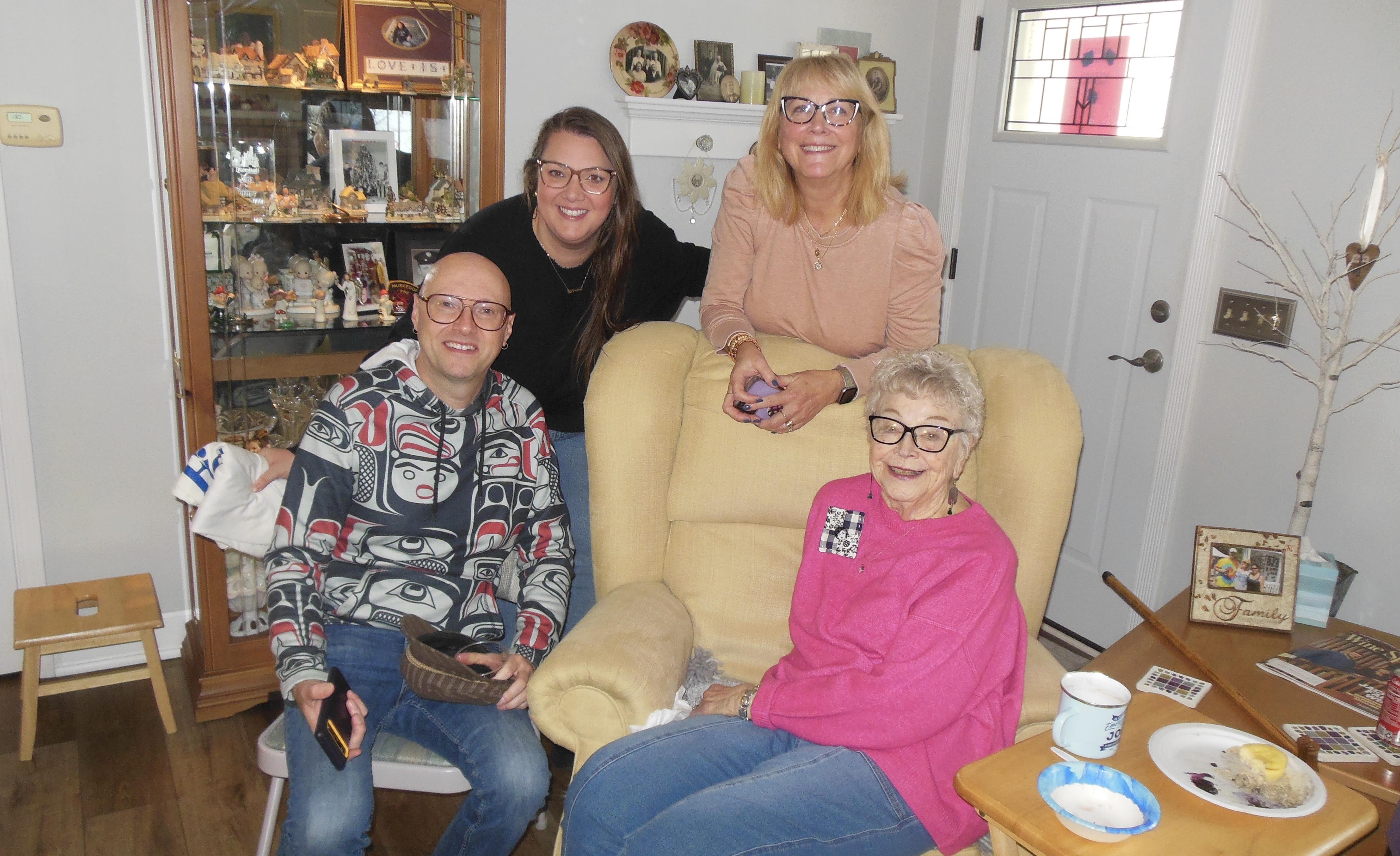 A group of people sitting in a chair