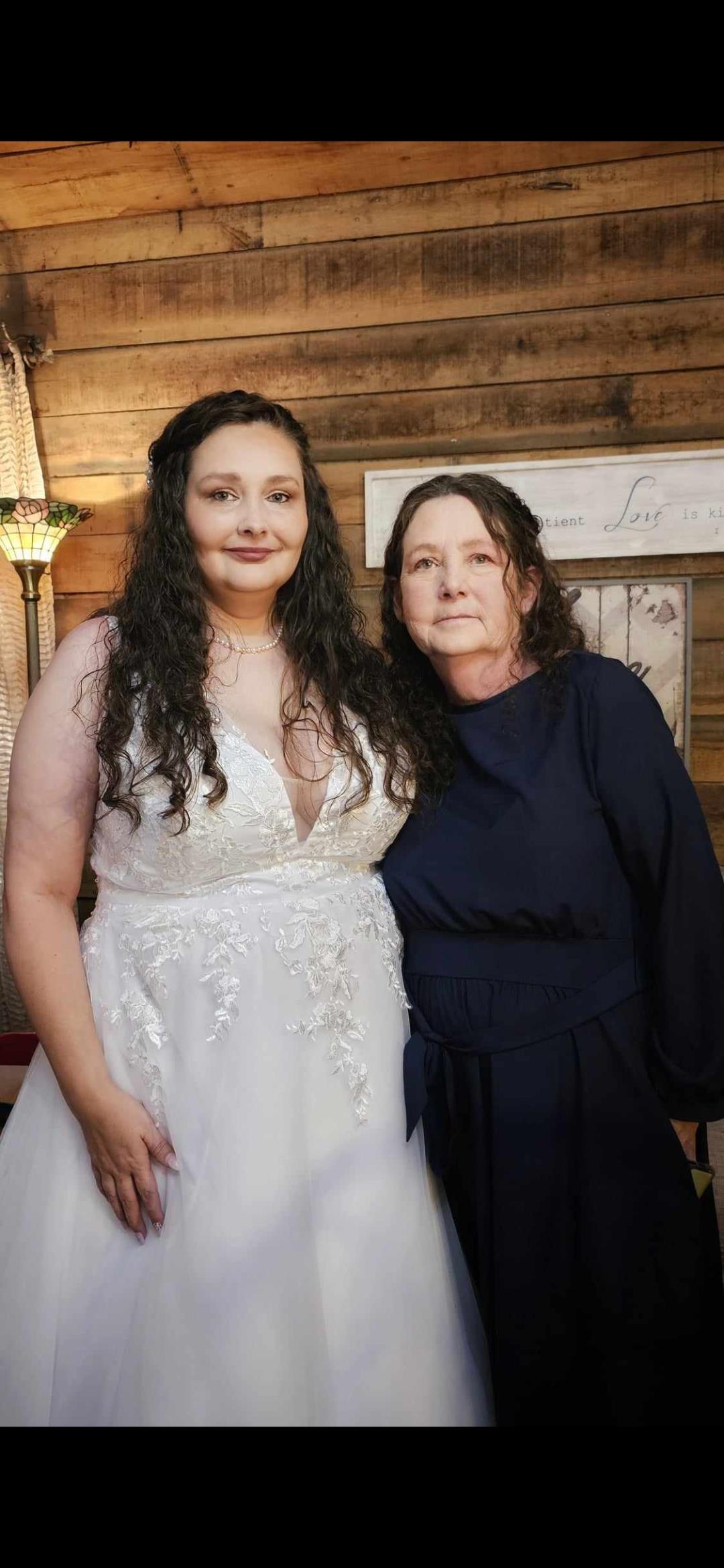 Two women standing together in a room