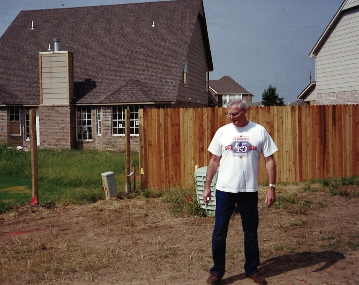 A man standing in a yard