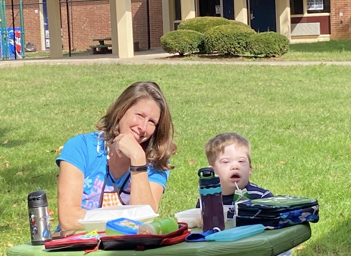 A woman and a child sitting at a table