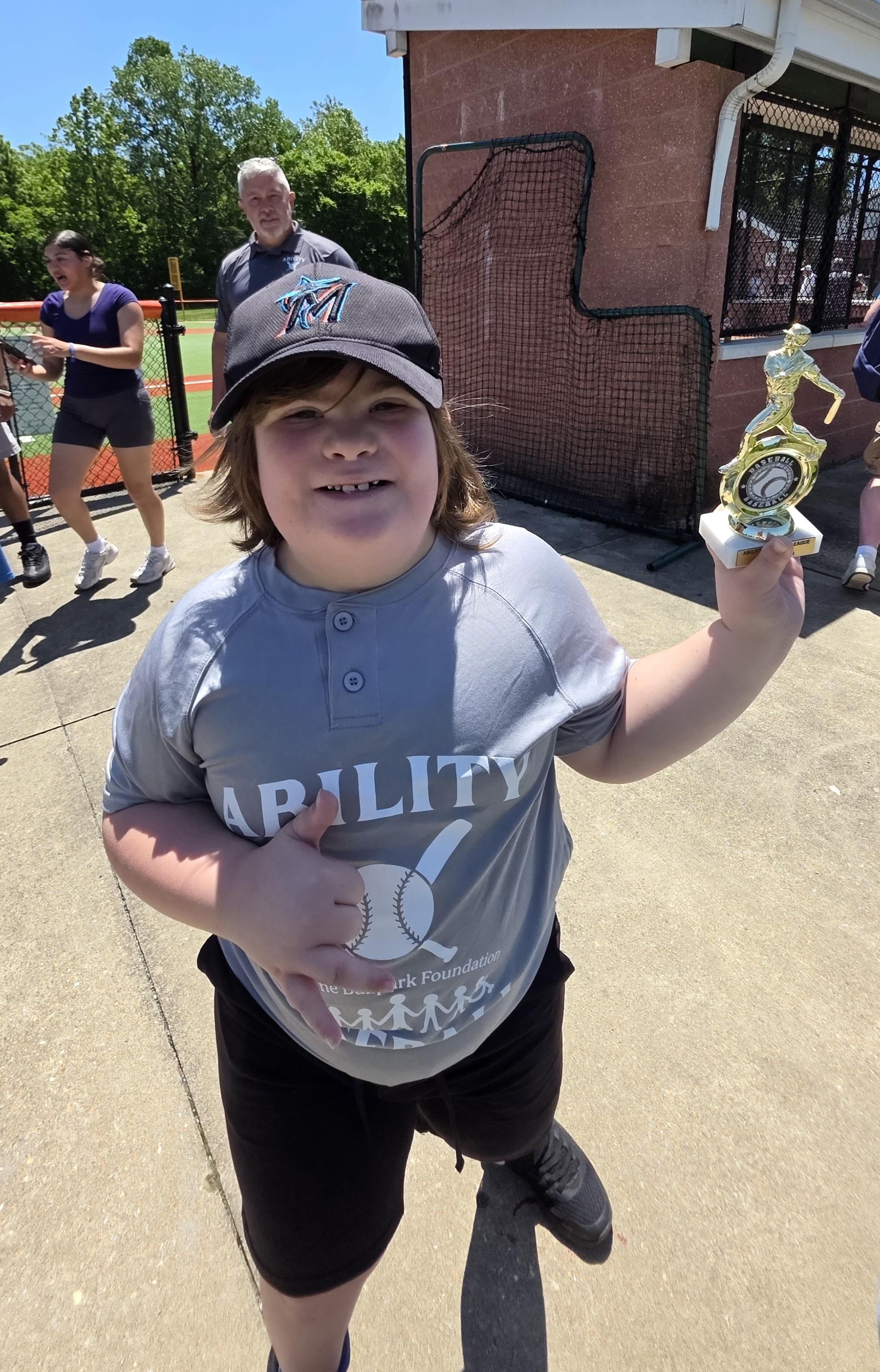 A boy holding a trophy